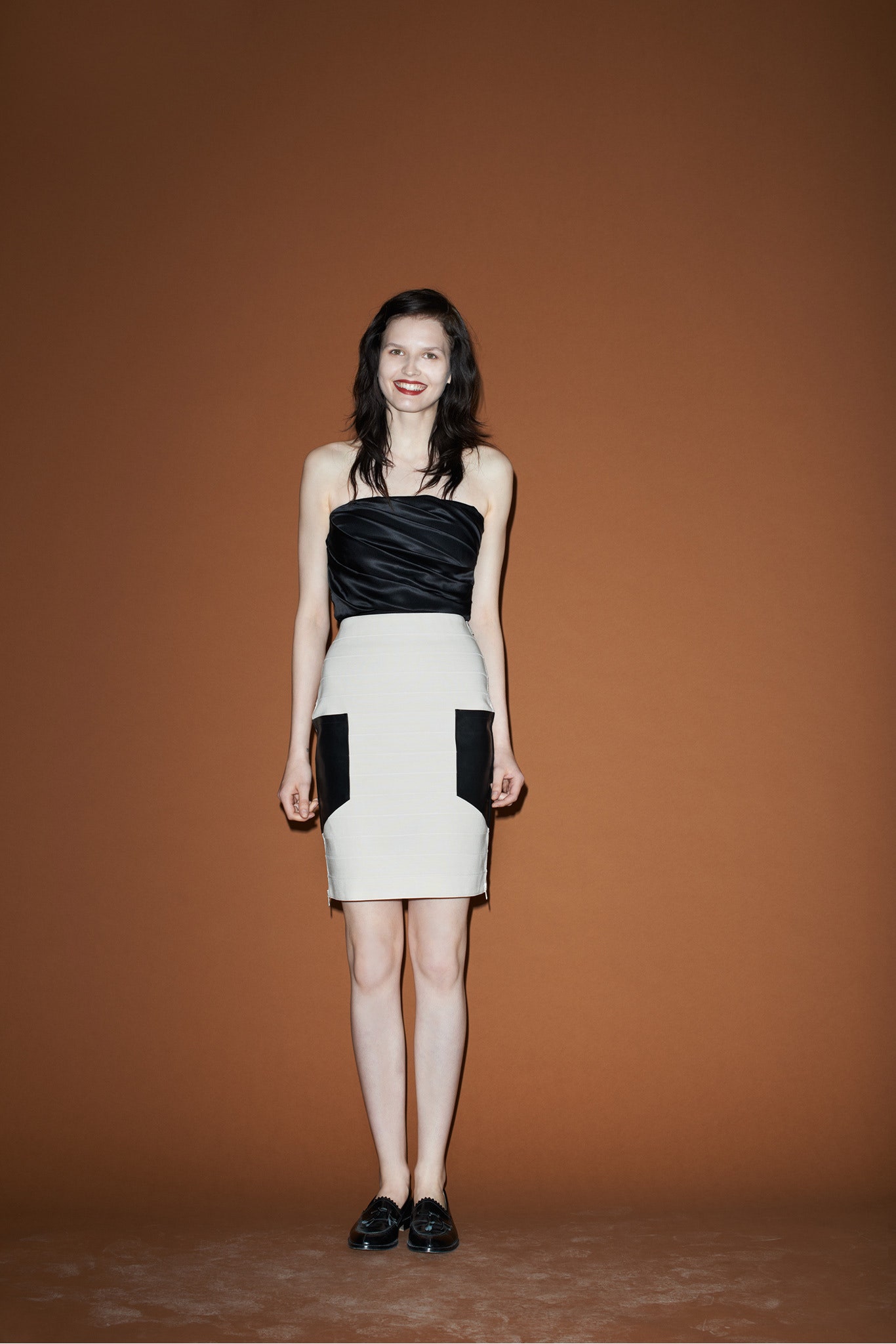 black silk strapless top and white pencil skirt