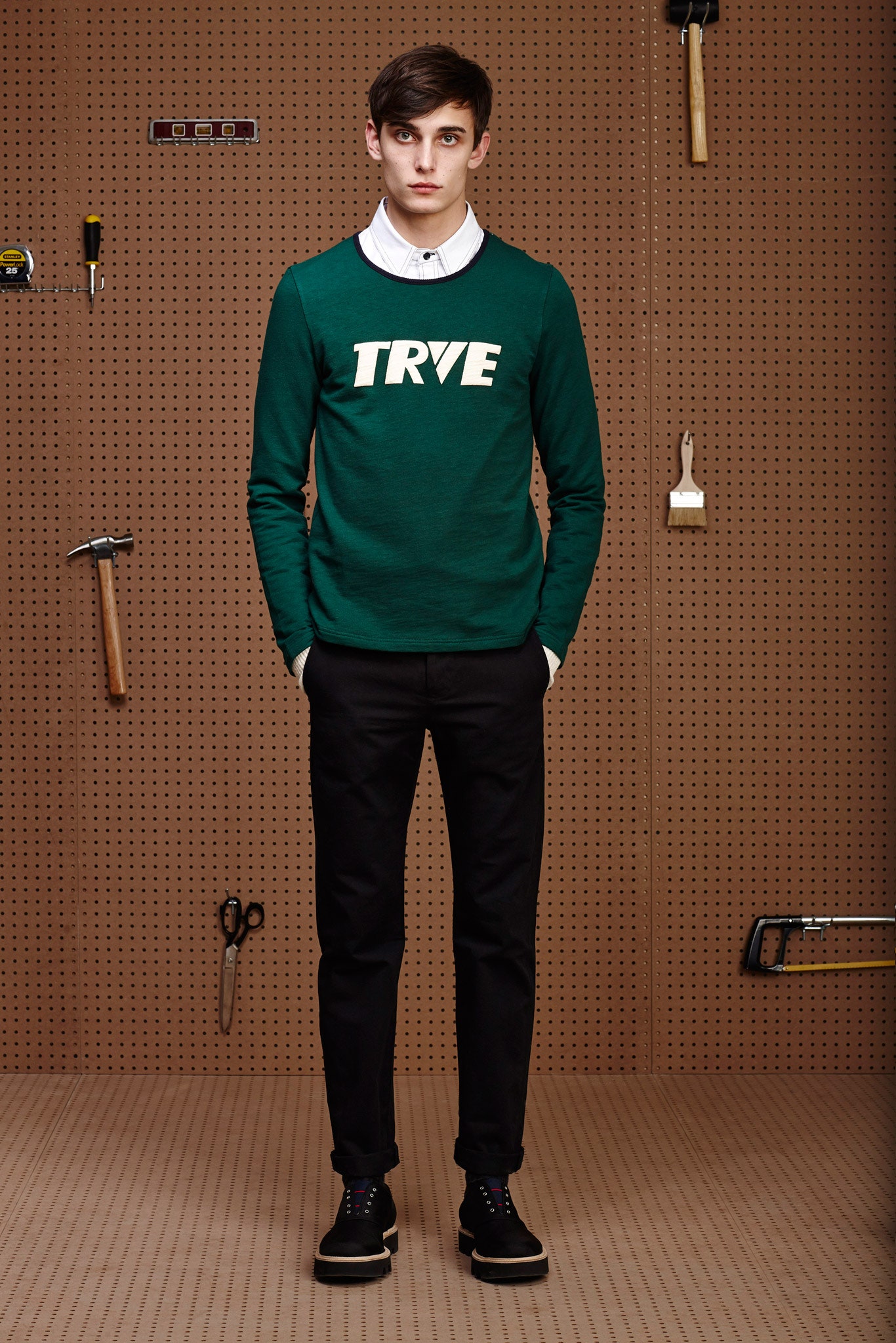 green printed sweater and black tailored pants