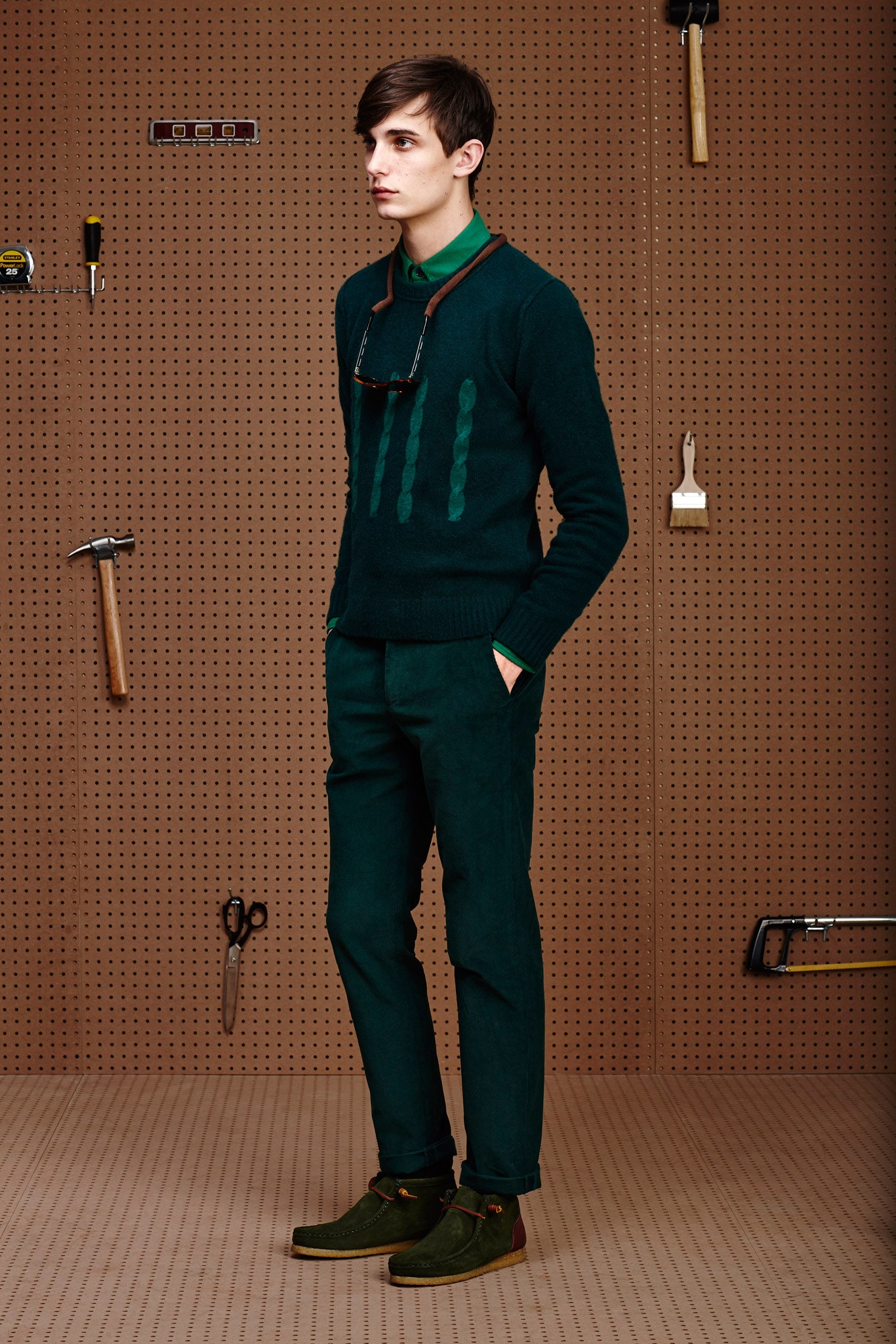 green wool sweater with tailored pants