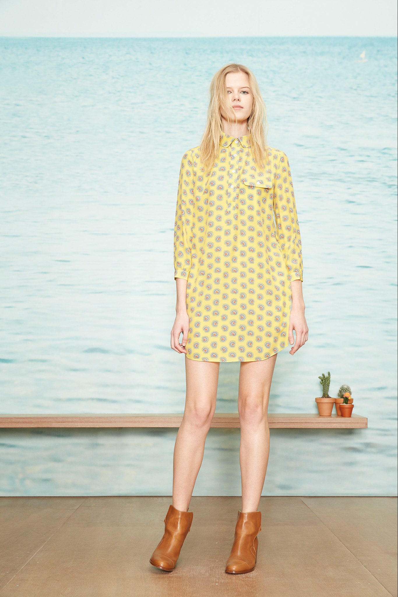 yellow printed short dress with brown boots