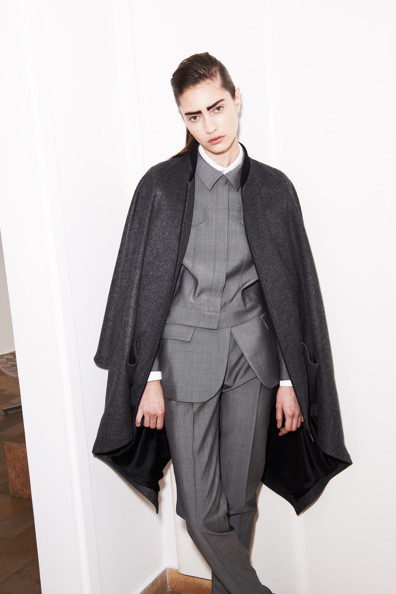 gray wool cape and tailored suit