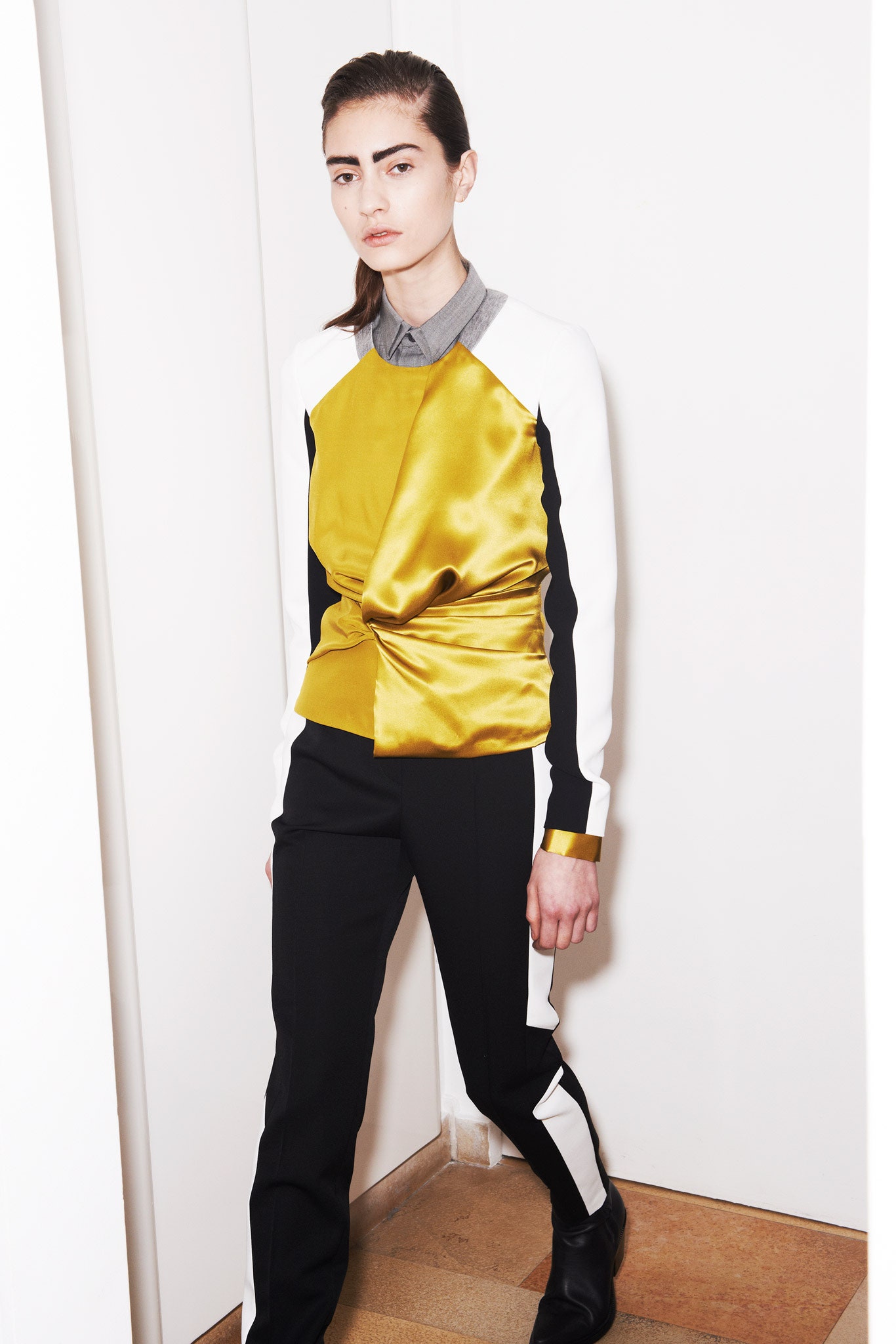 fitted yellow top with black pants