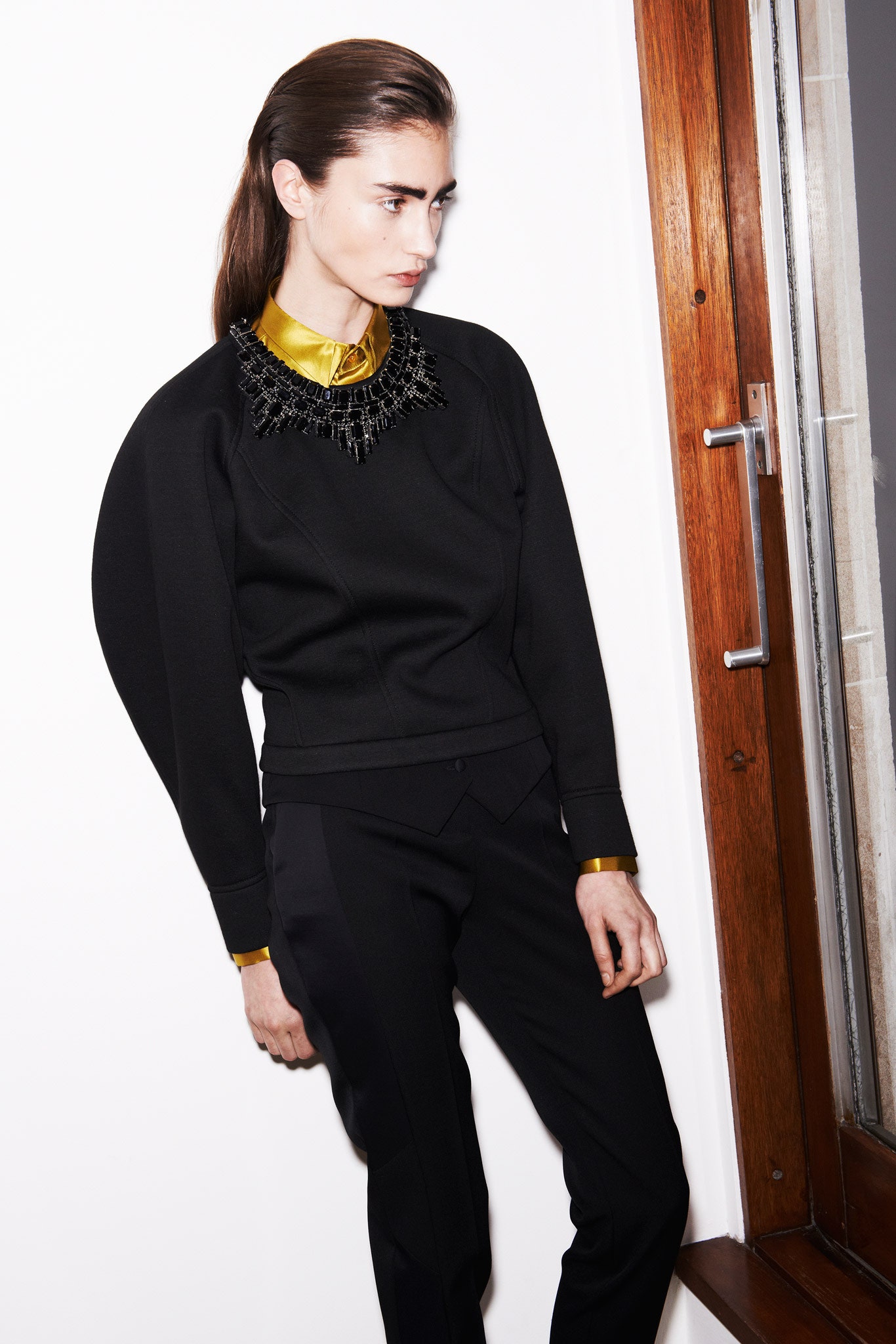black fitted top and tailored pants