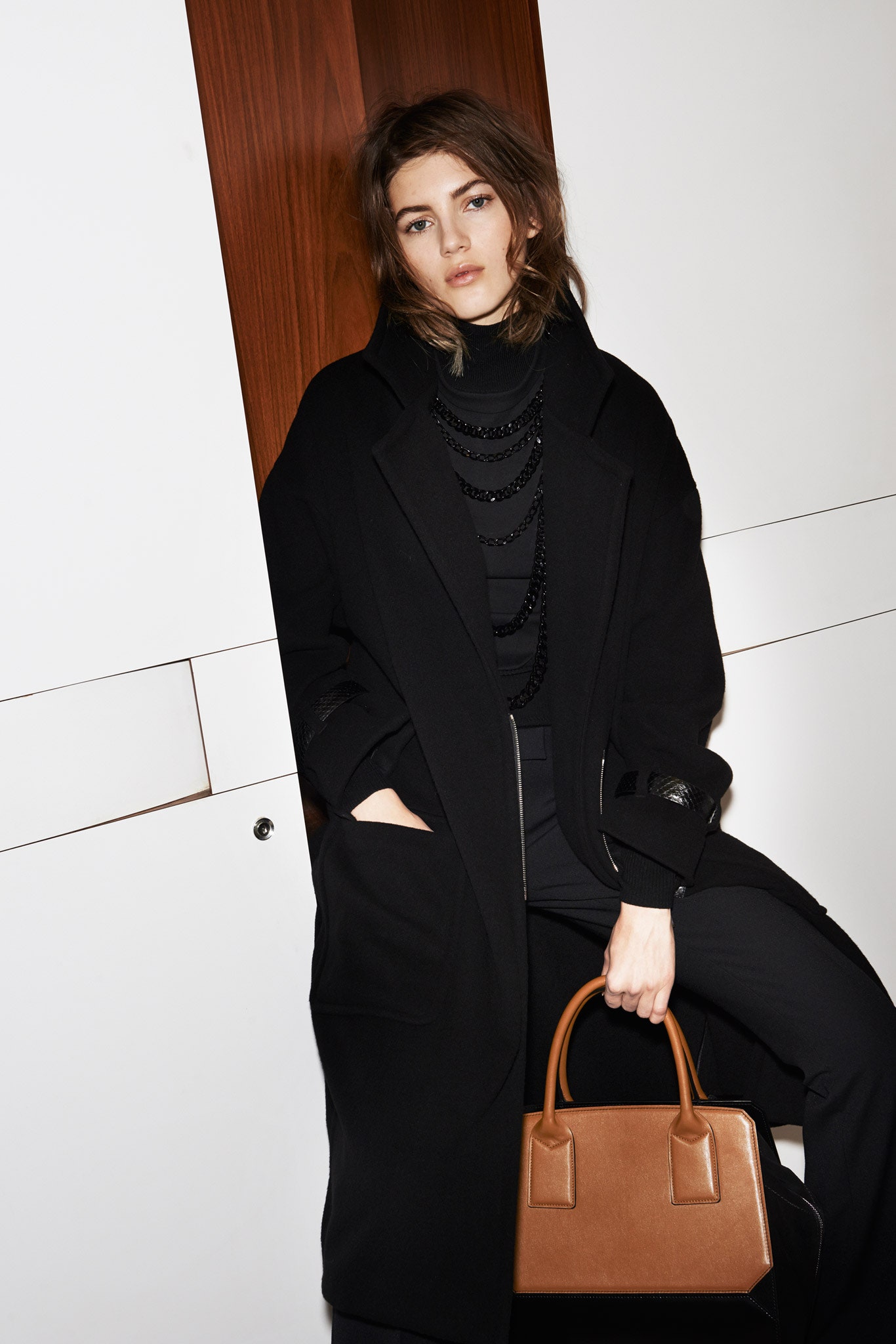 black wool coat with fitted top