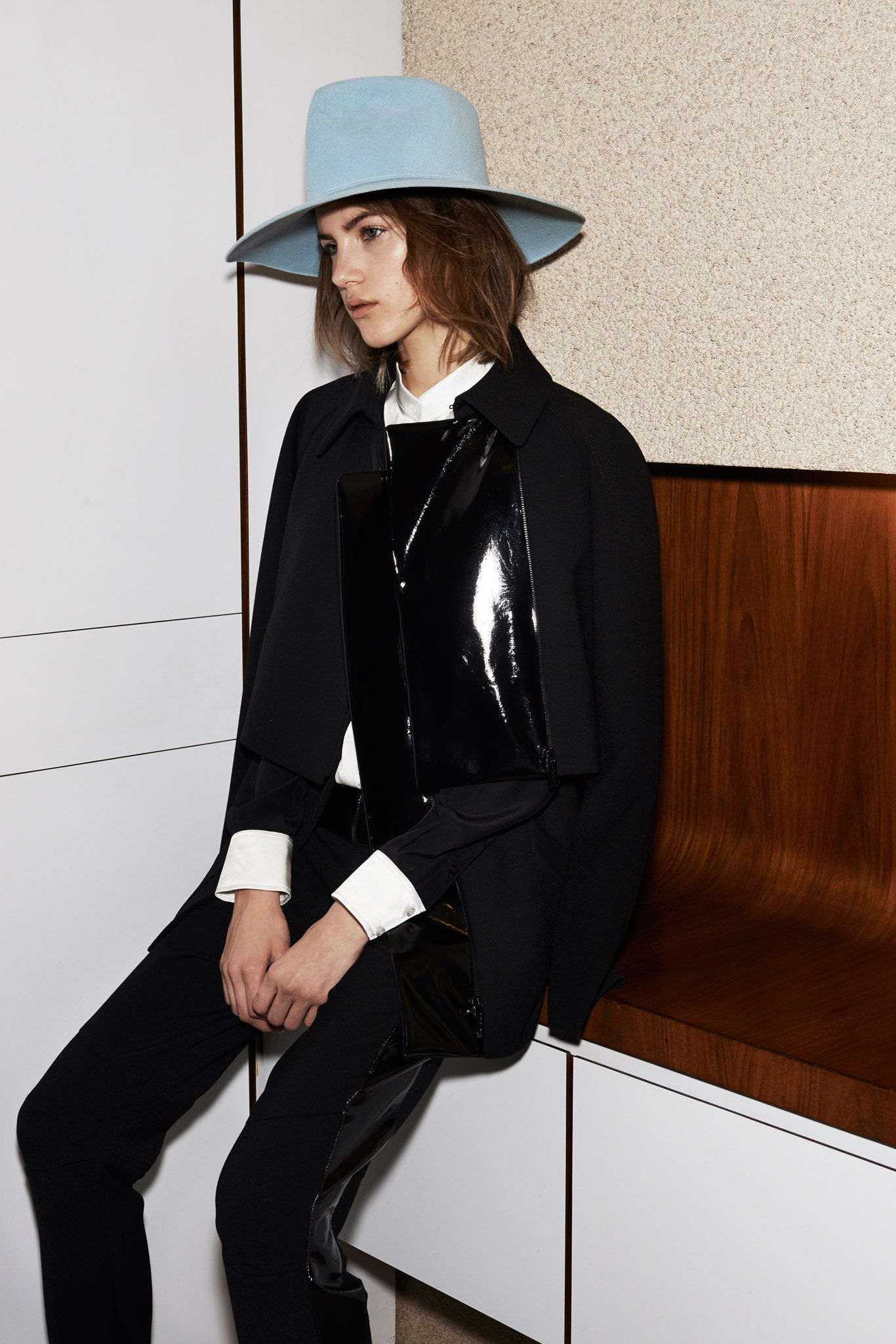 black vinyl coat with white shirt