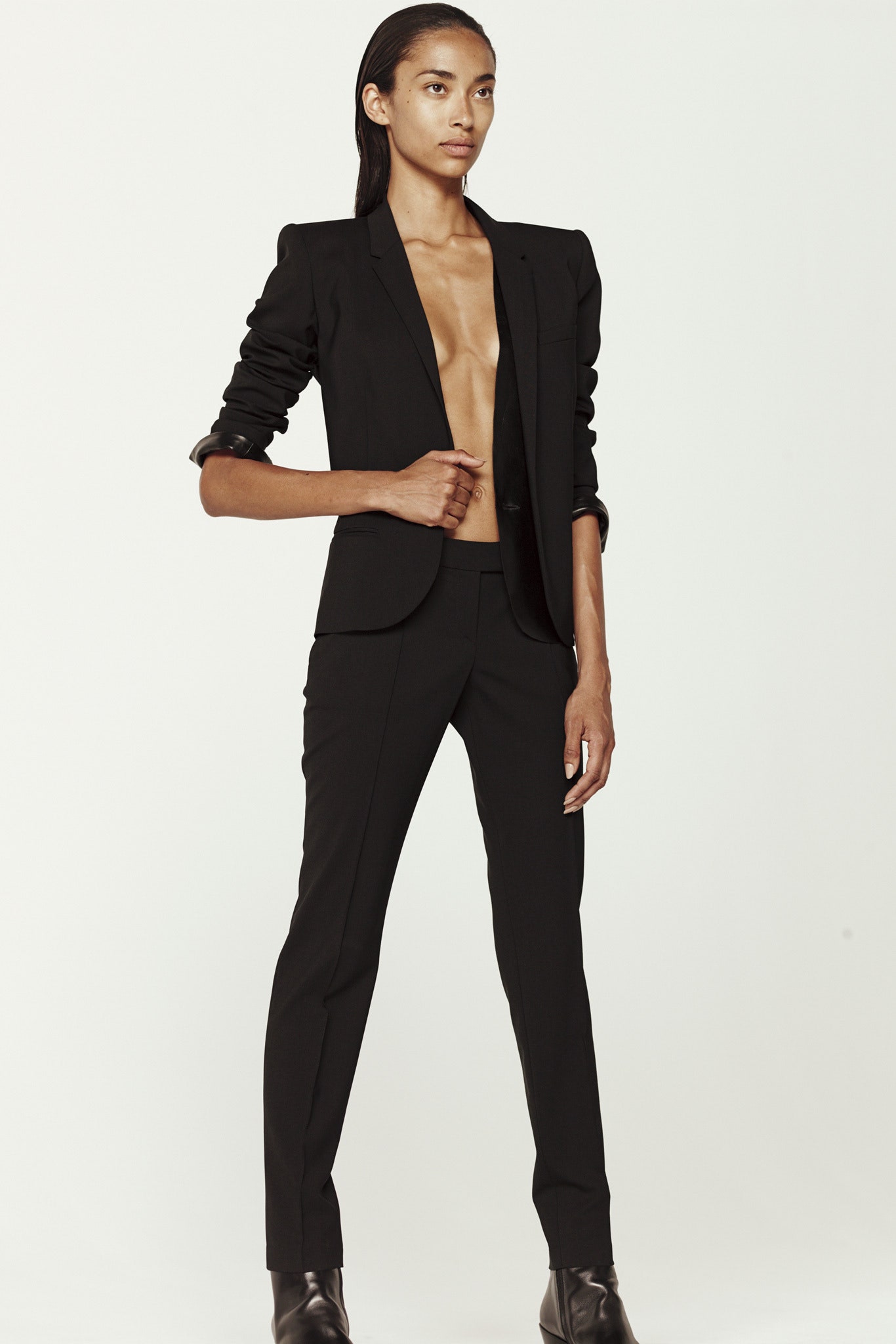 black tailored blazer and slim pants
