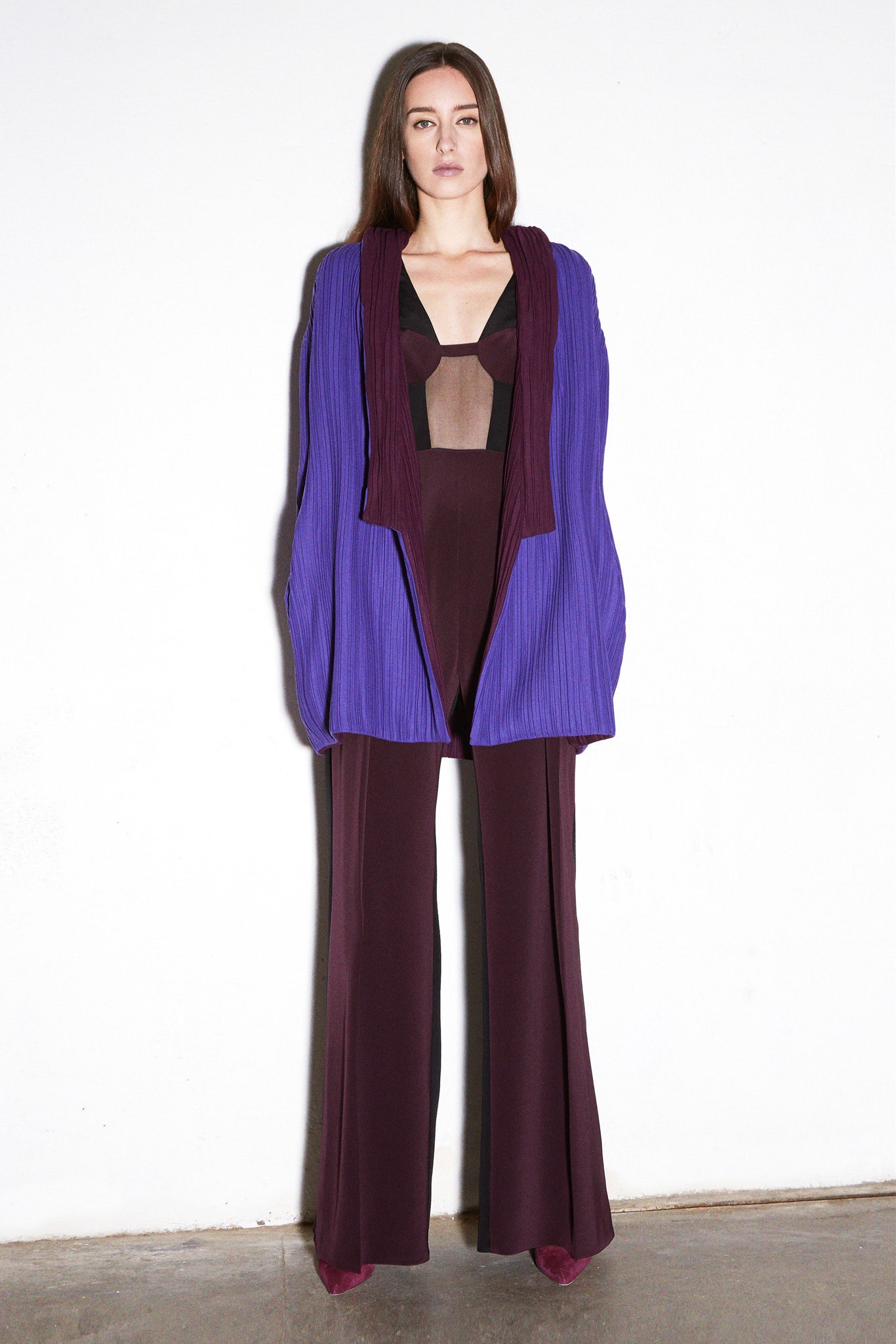 purple pleated jacket with maroon jumpsuit