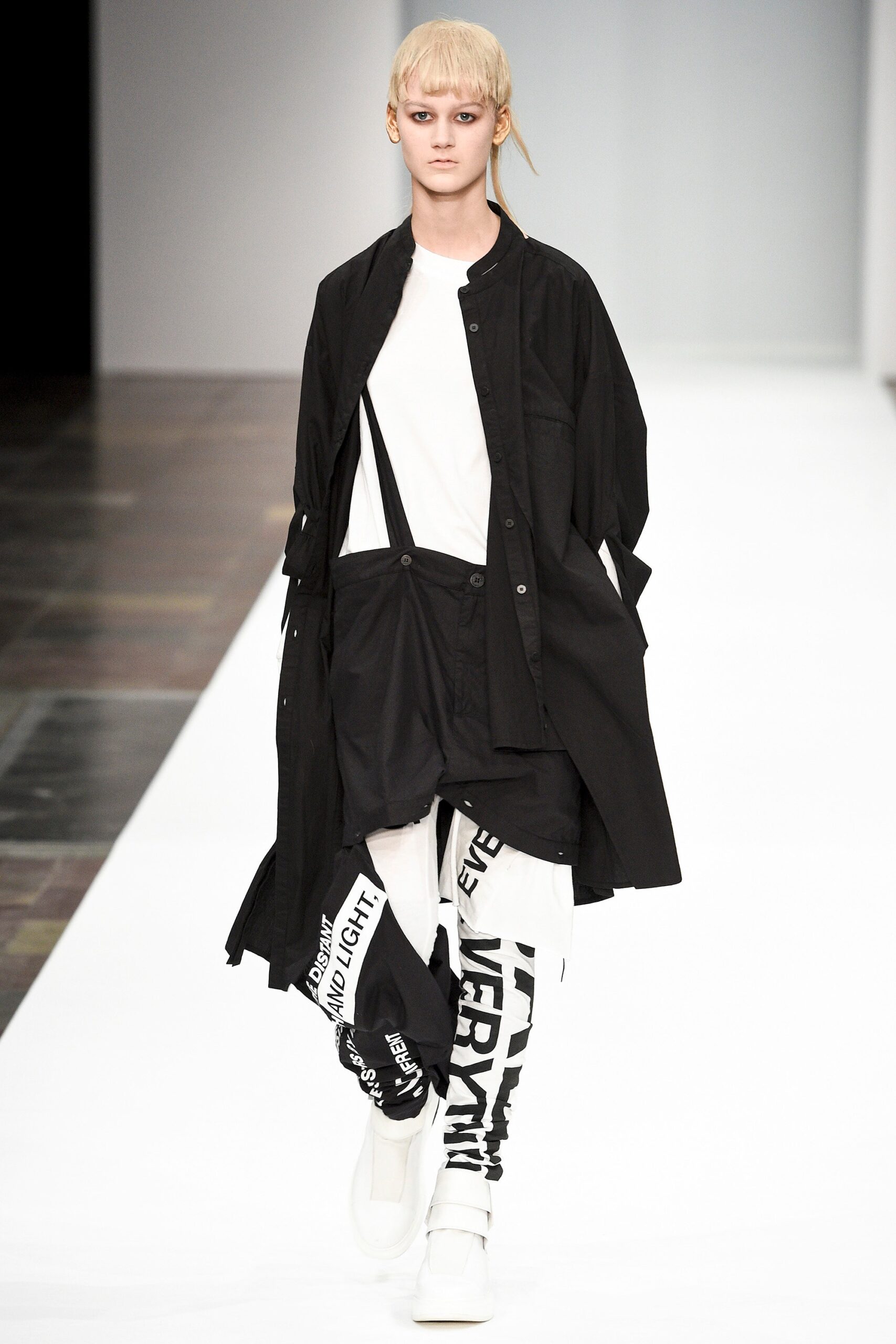black coat white t-shirt cargo pants