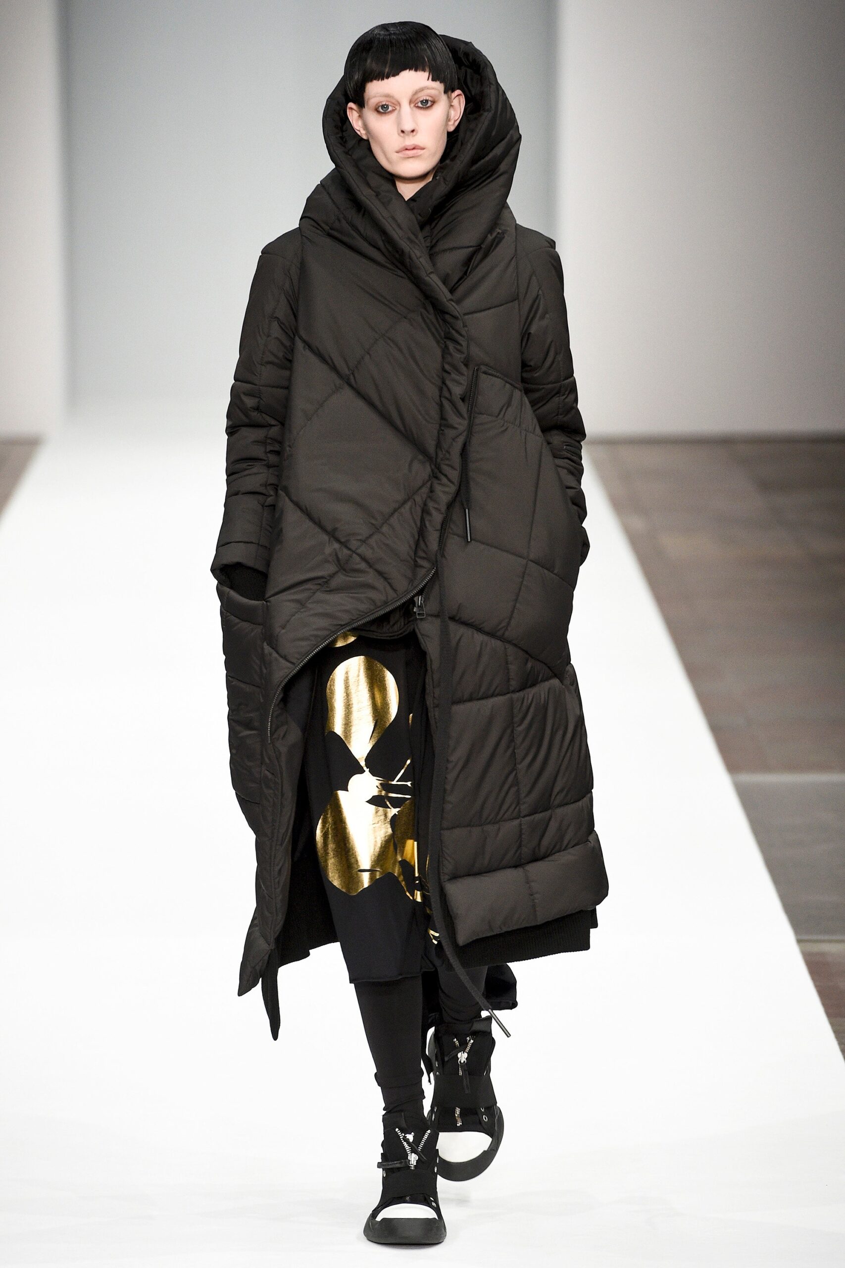 black quilted coat and layered dress