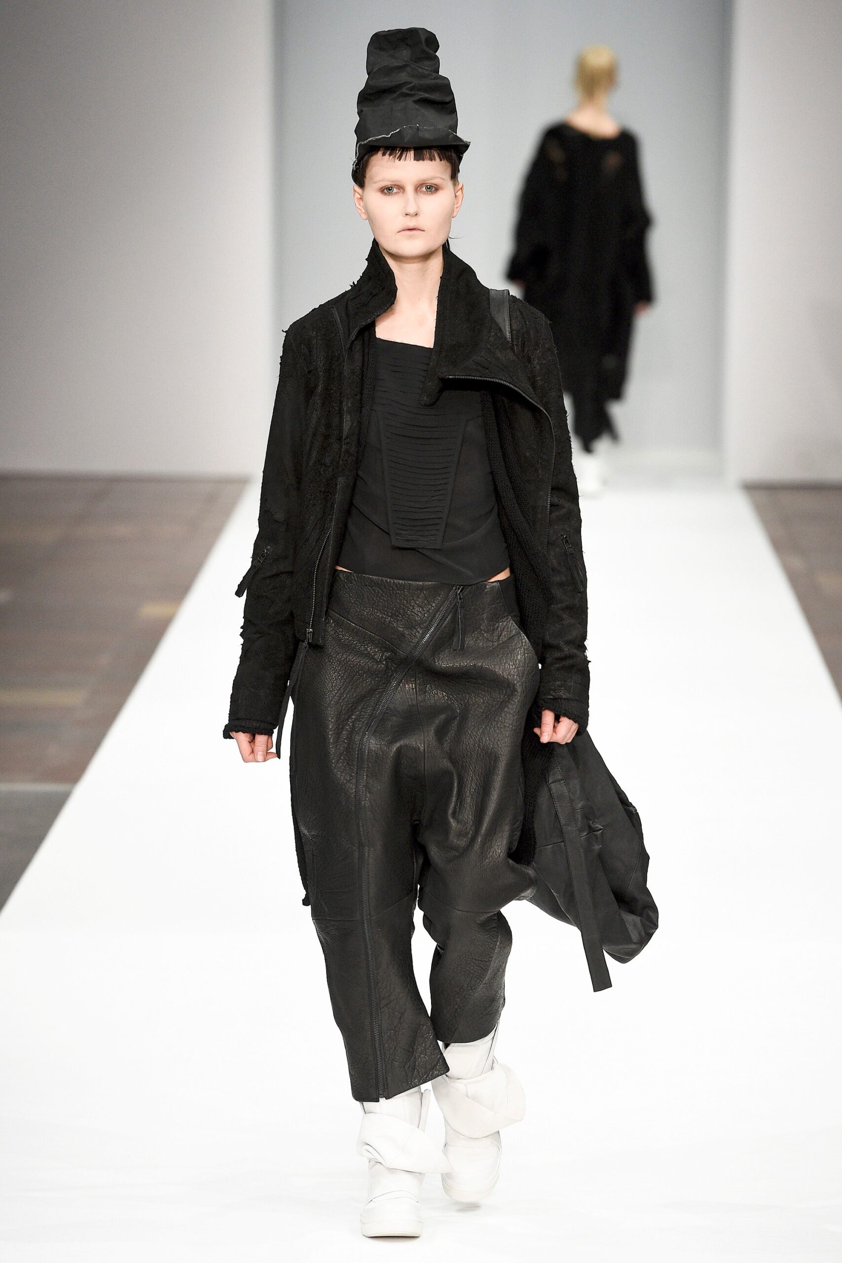 black leather jacket with relaxed pants