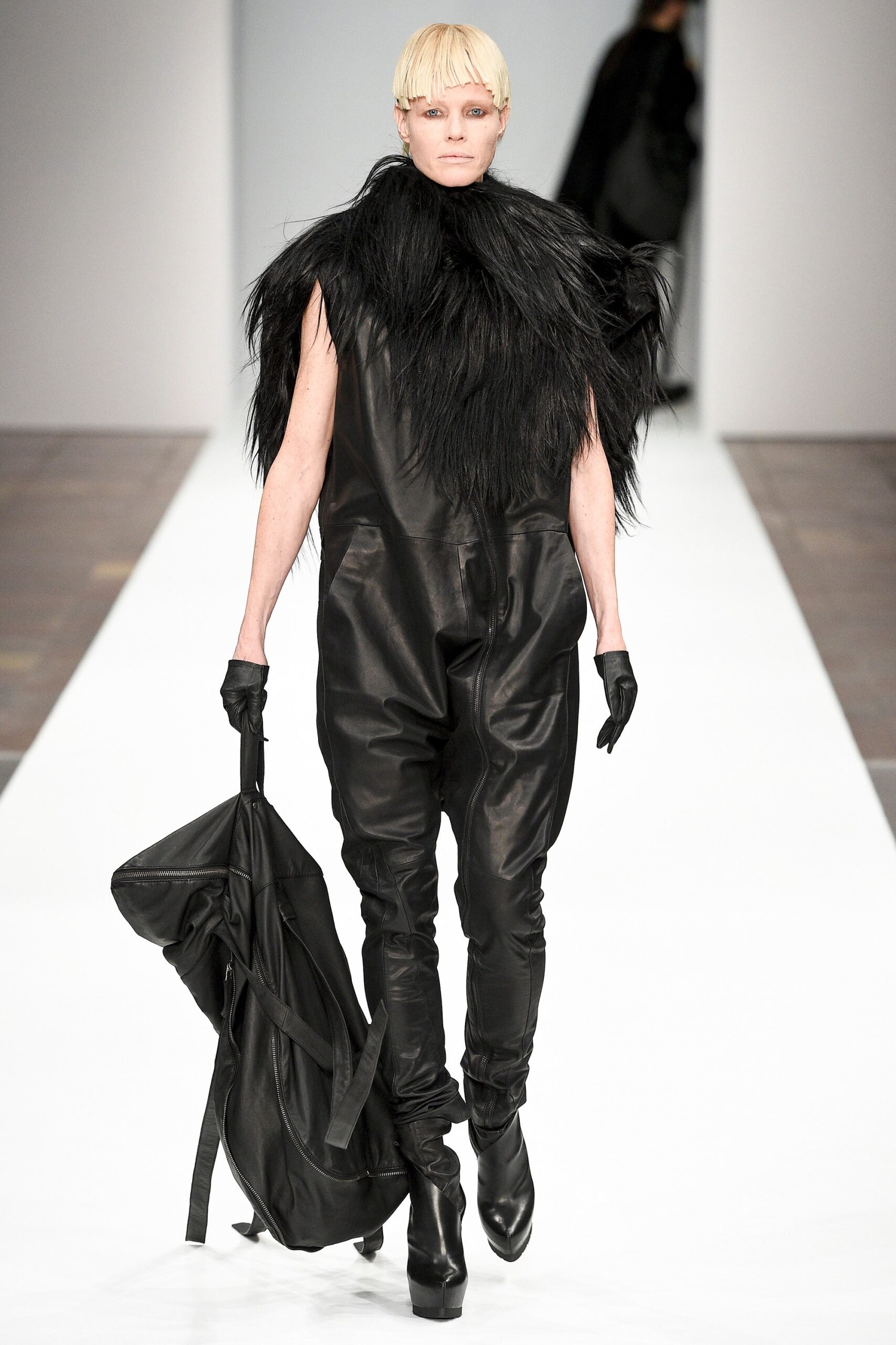 black leather jumpsuit with fur cape