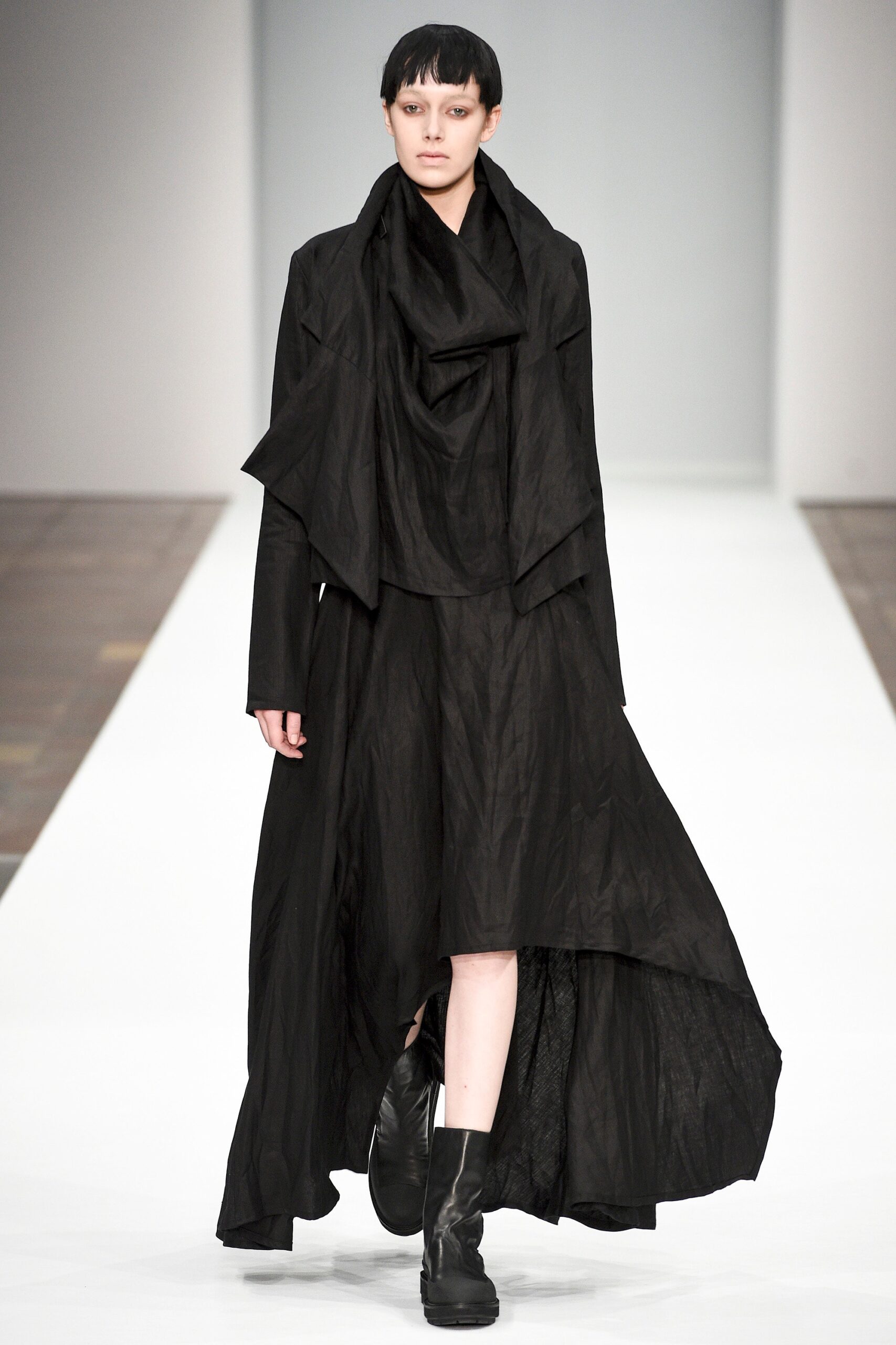 black relaxed coat and fitted dress