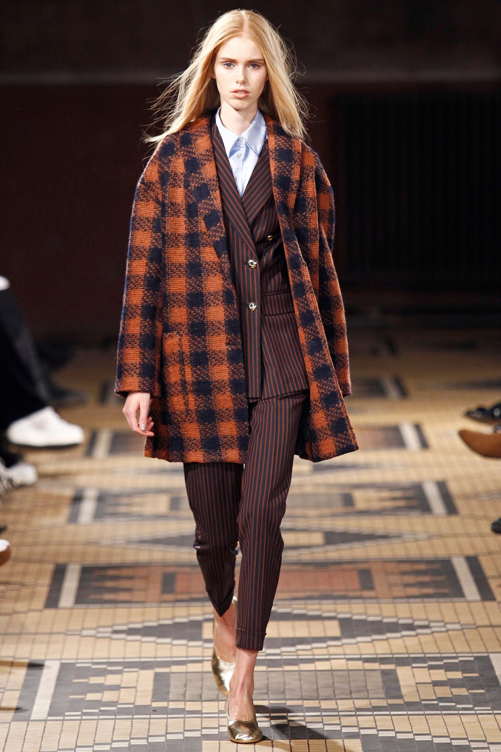 checked coat with tailored suit