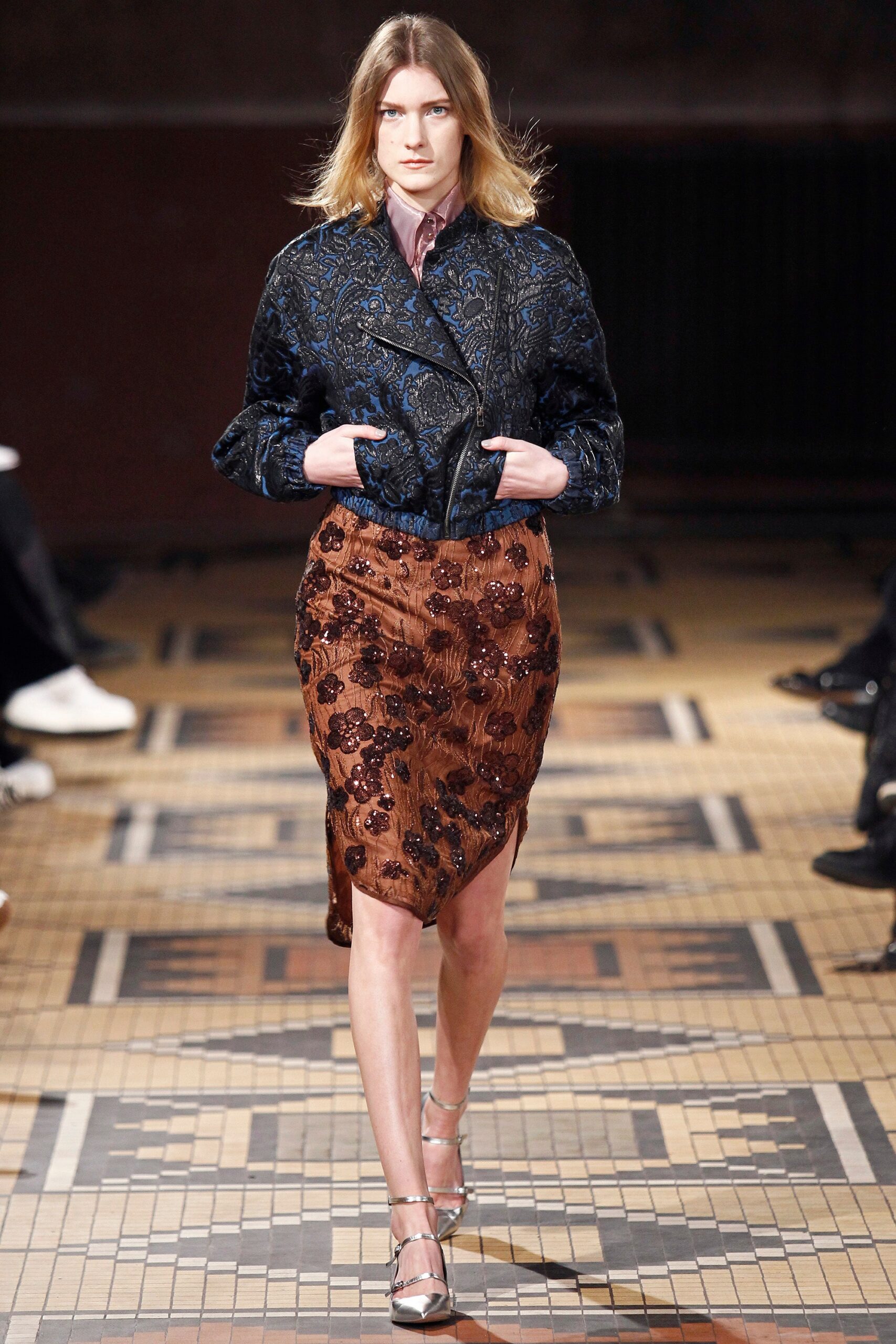 blue silk fitted jacket and brown skirt