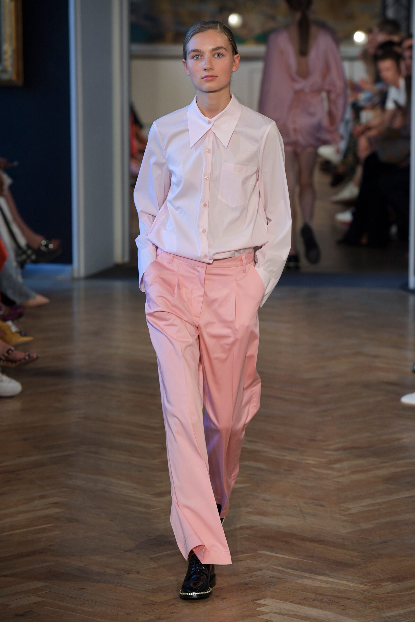white relaxed shirt and pink pants