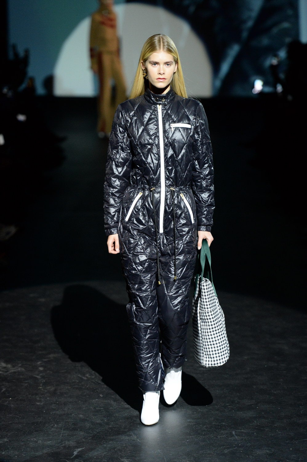 black quilted jumpsuit with checked bag