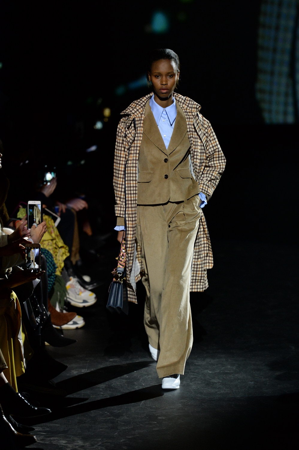 beige checked trench coat with tailored suit