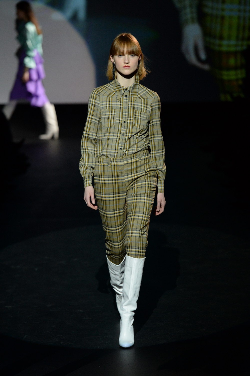 checked green and yellow jumpsuit with white boots