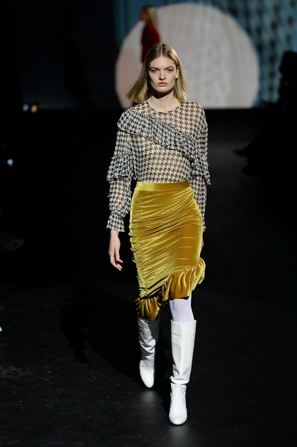 black and white ruffled blouse with yellow skirt