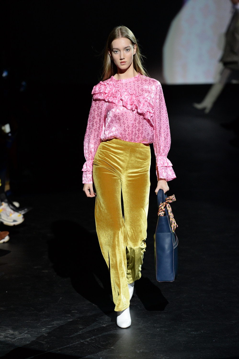 pink ruffled top and yellow flared pants