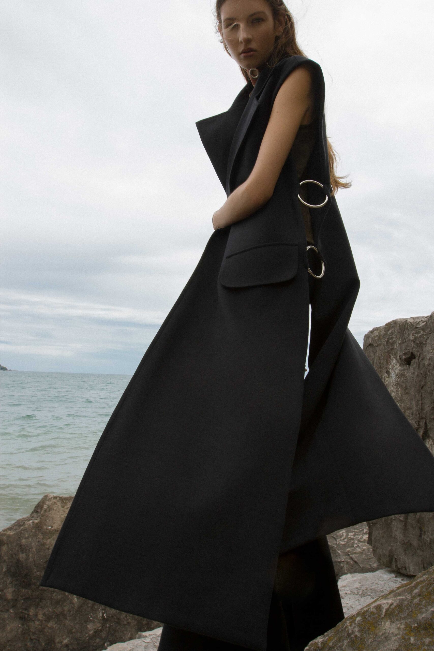 black sleeveless structured maxi coat