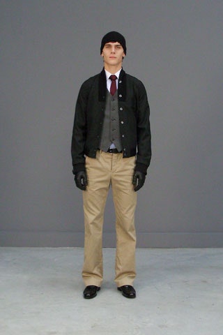 black jacket gray vest beige pants