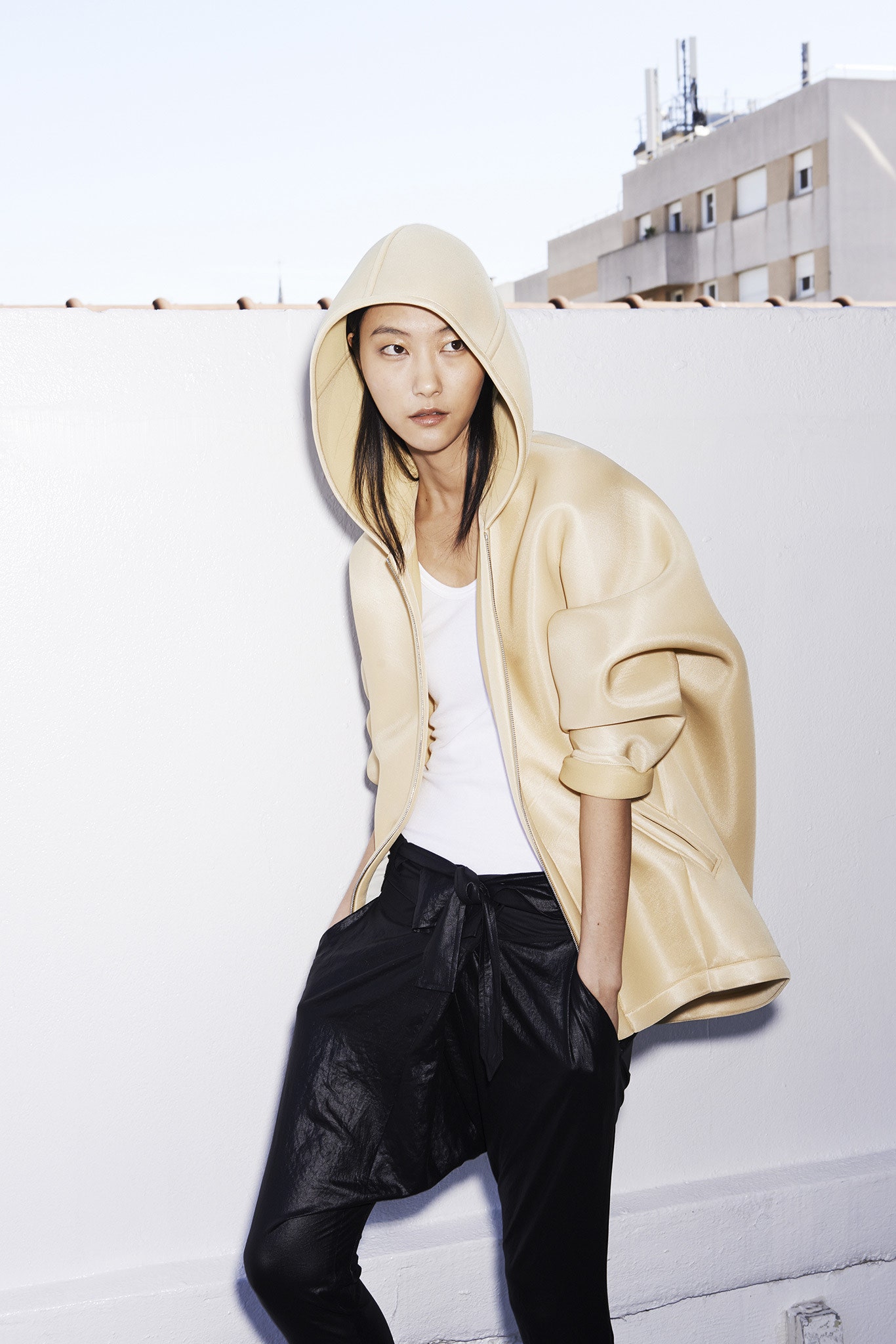 beige oversized hoodie and black pants