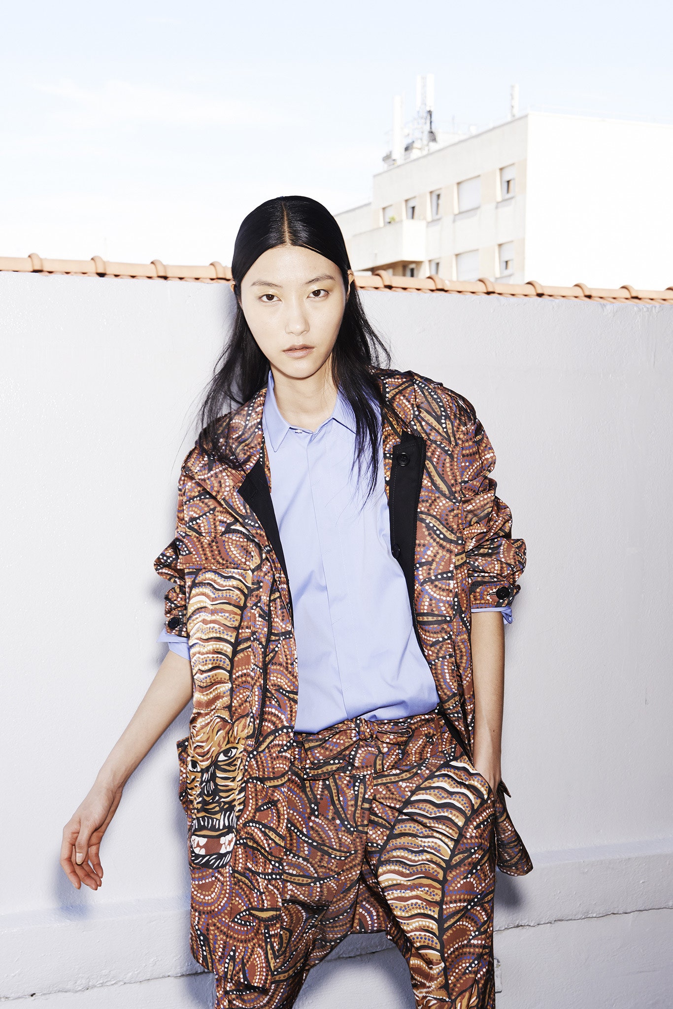 multi printed jacket with blue shirt