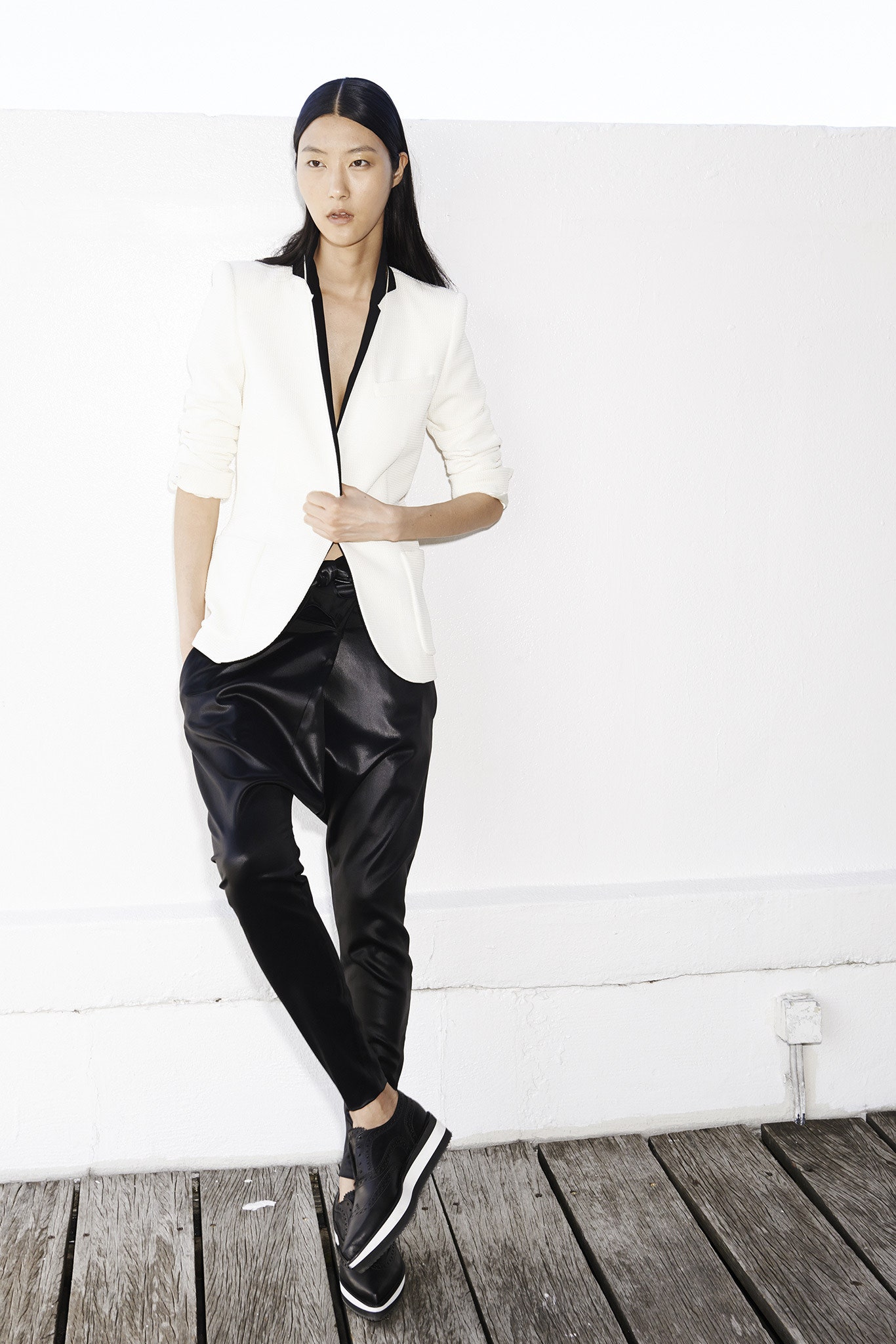 white tailored blazer with black pants