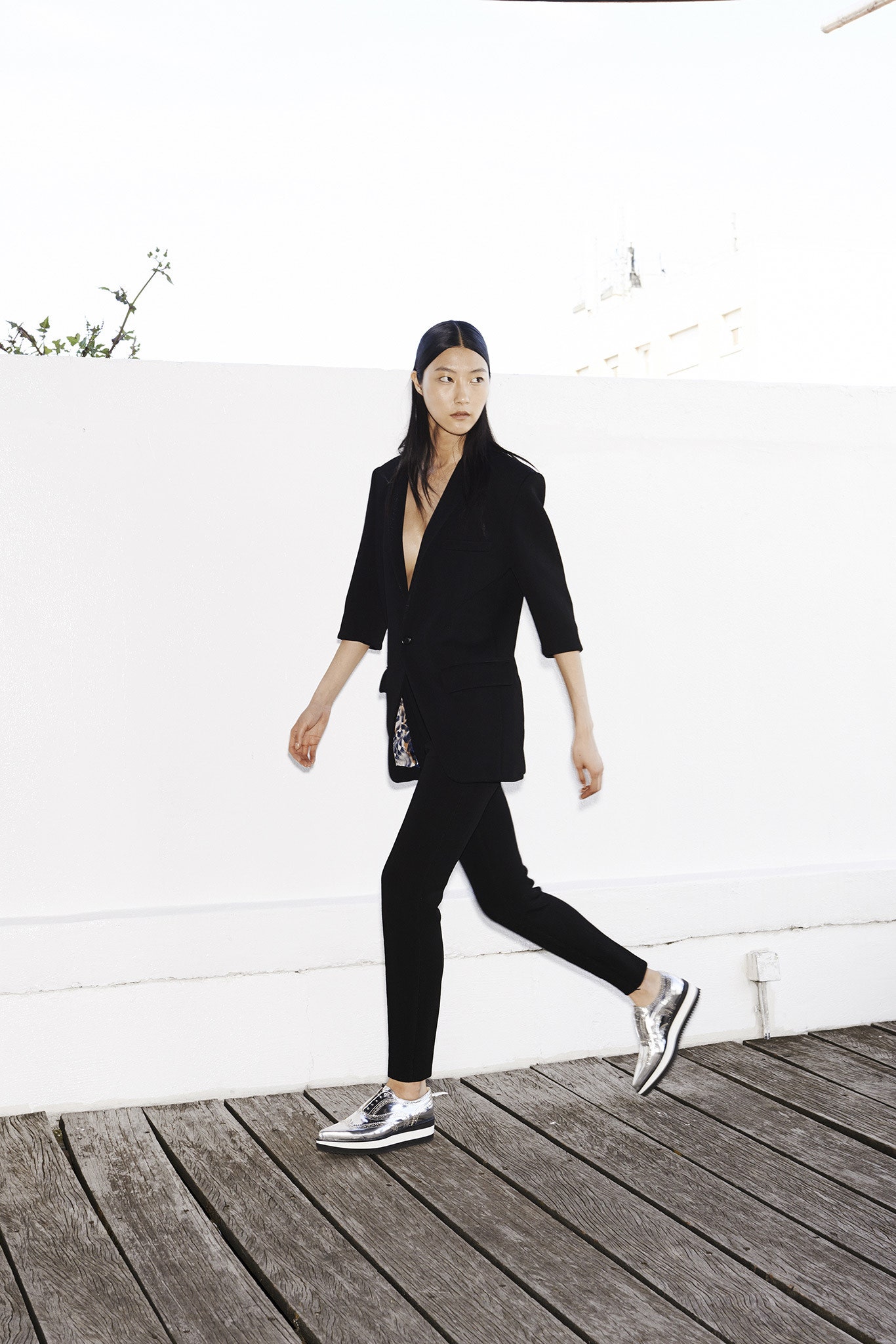 black tailored blazer with slim pants