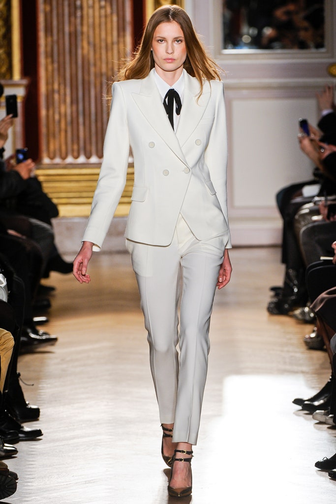 white tailored suit with black shoes