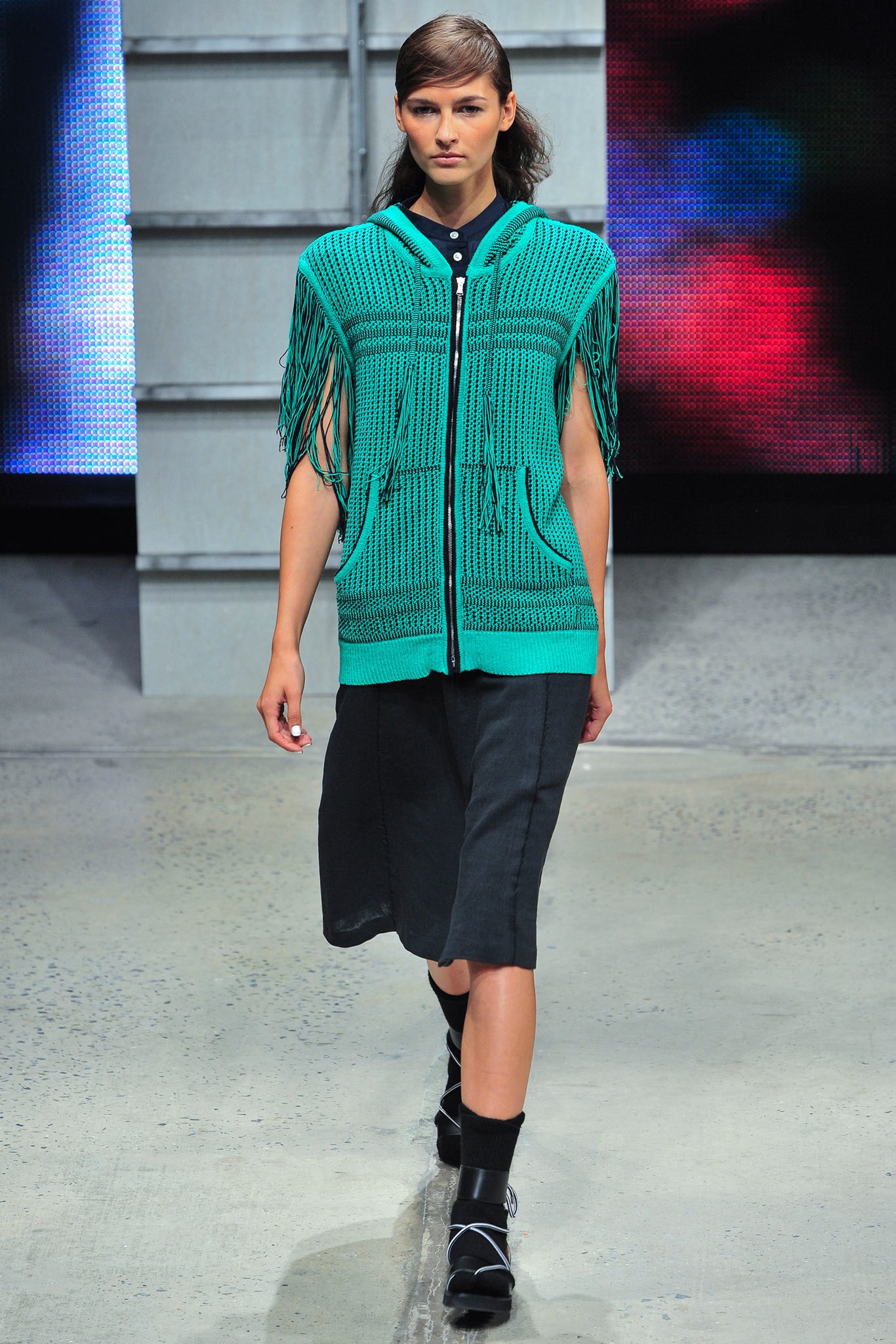 green fringed top with black skirt