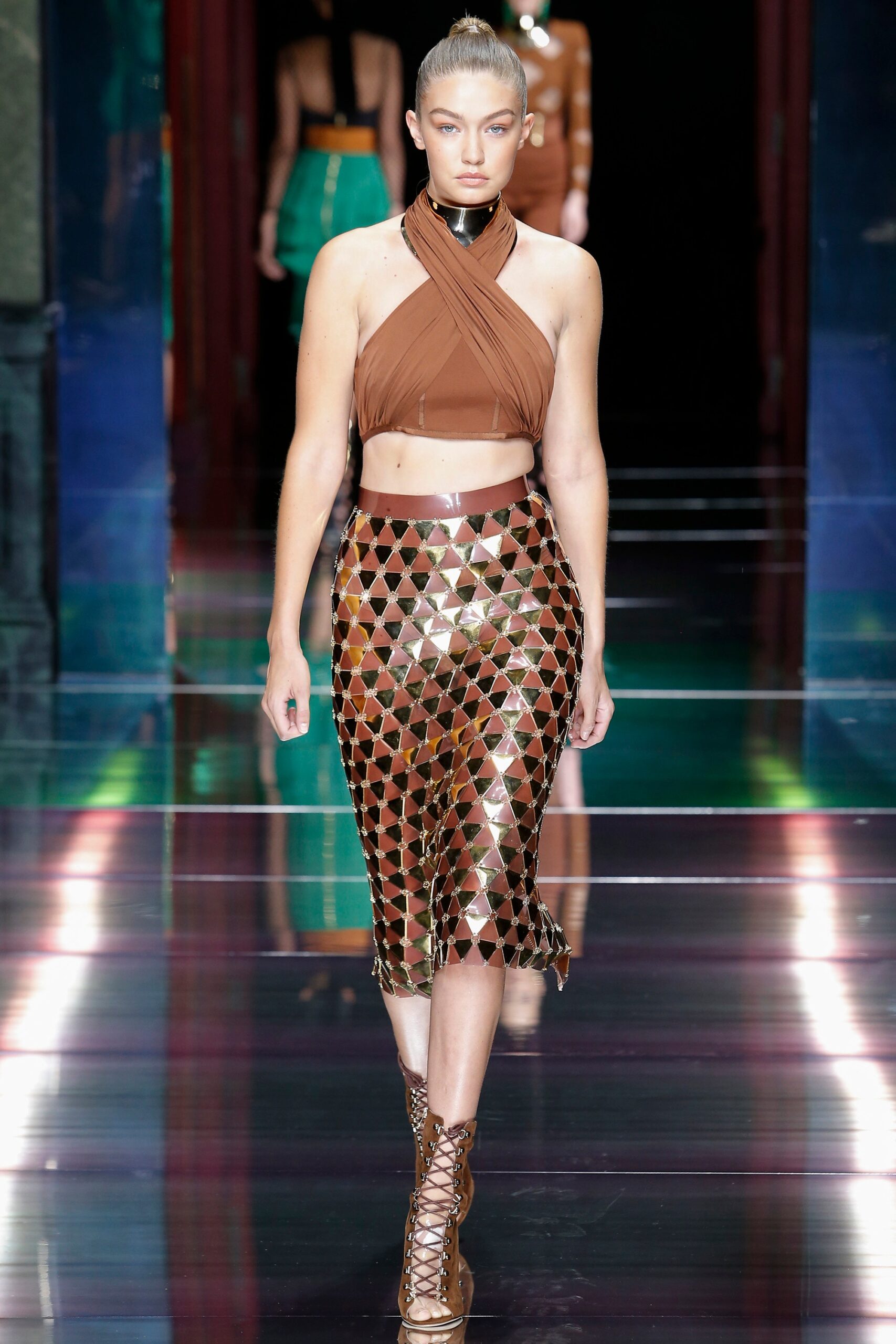 brown silk crop-top and gold midi skirt