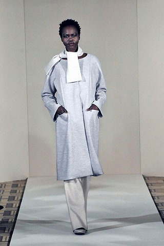 gray cotton relaxed coat with beige pants