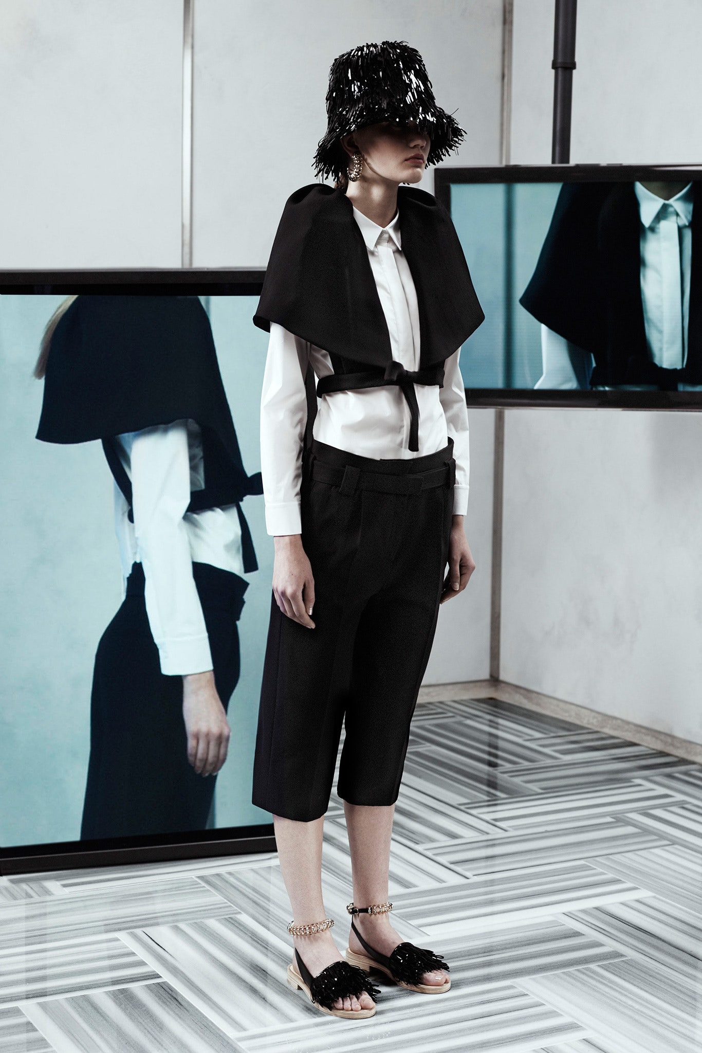 black cape white blouse tailored pants