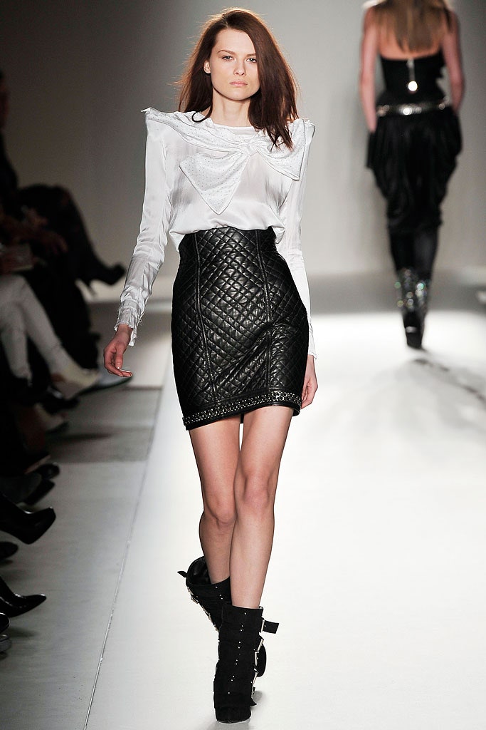 white silk ruffled blouse and black leather skirt