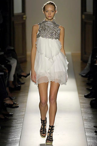 white silk sleeveless high-neck fitted ruffled layered dress