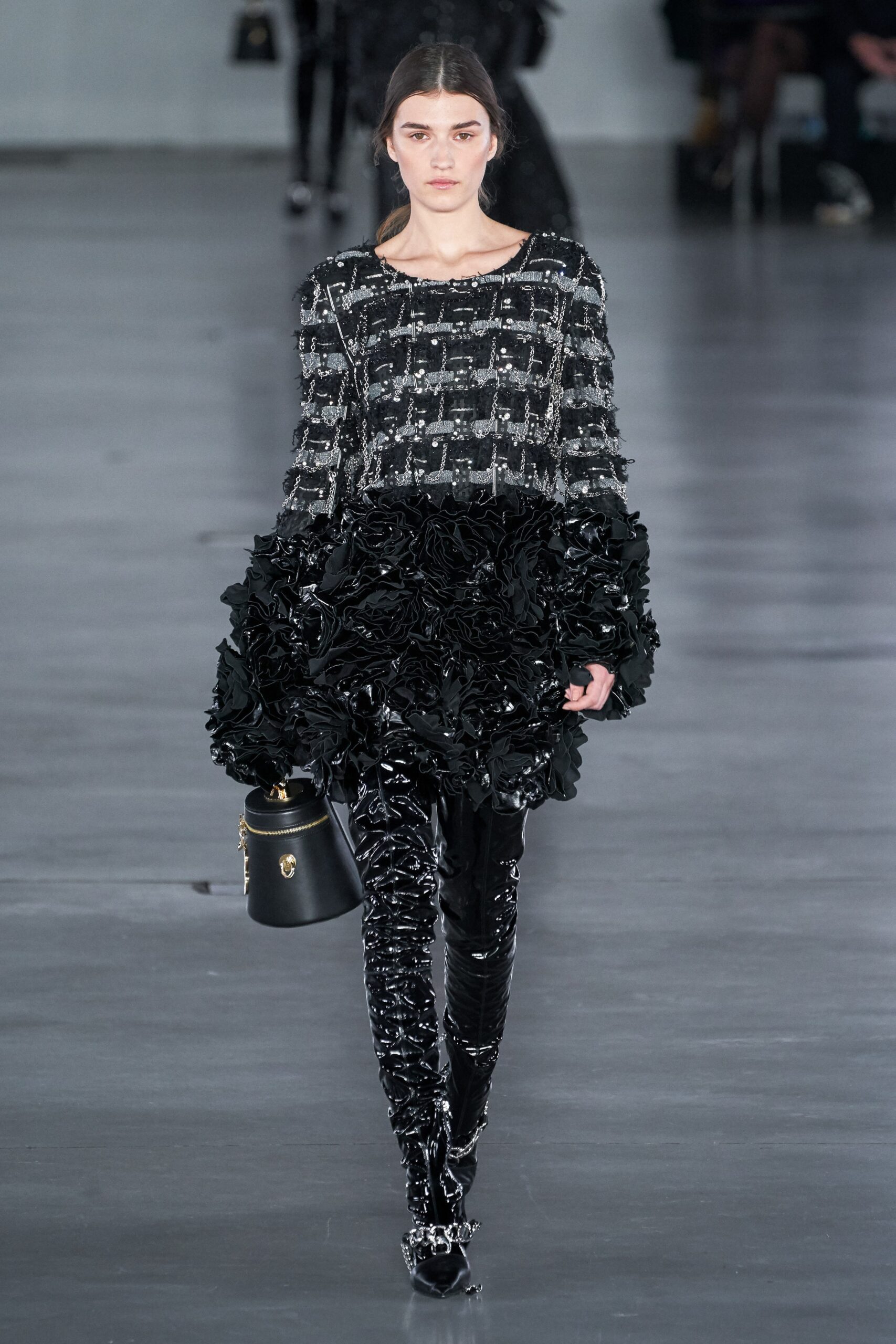 black and white ruffled top with vinyl pants