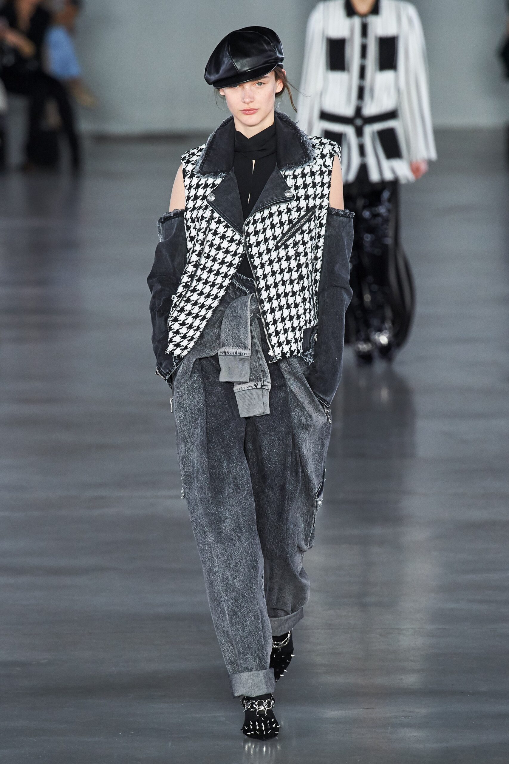 black and white checked vest with gray pants