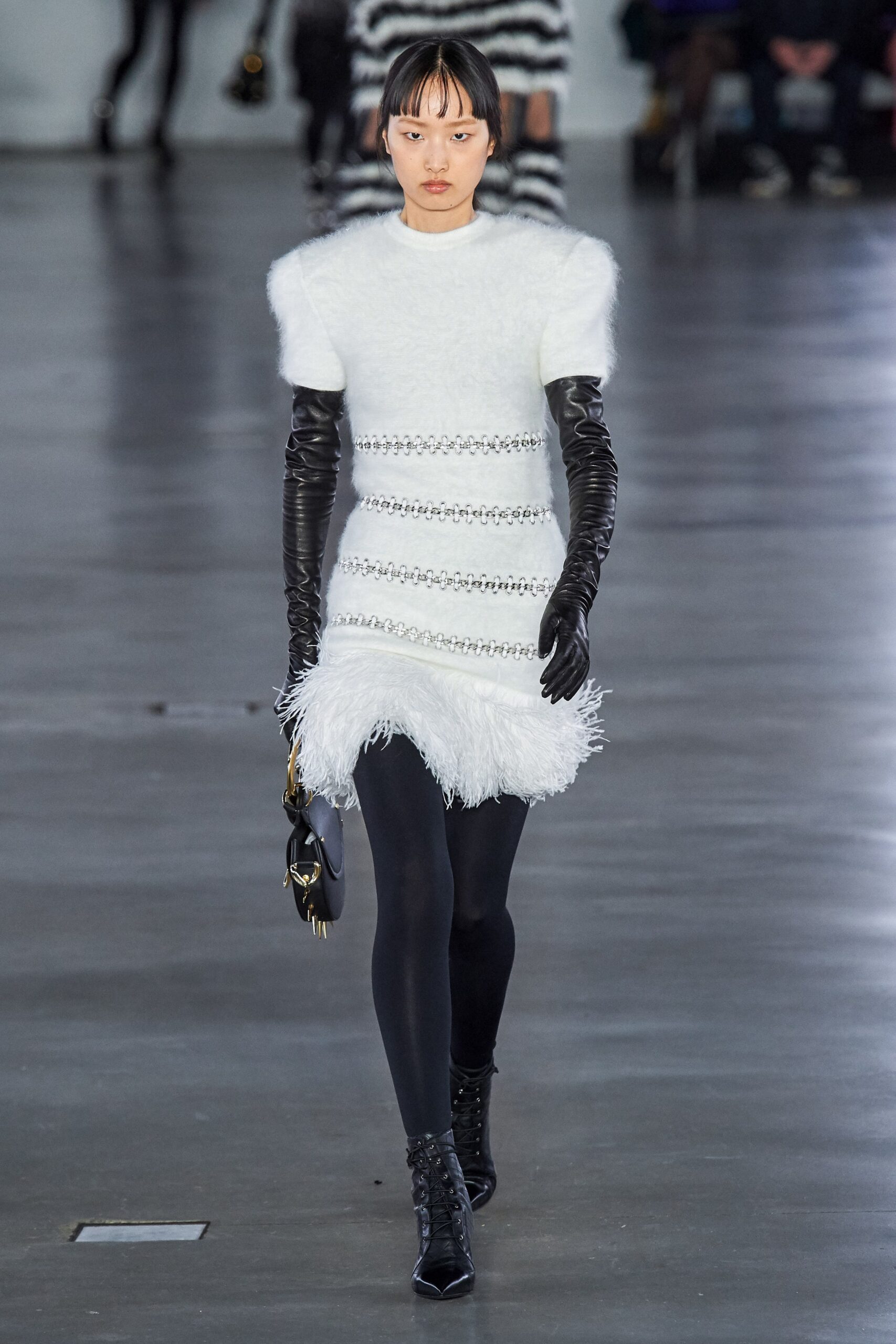 white fitted dress with black gloves