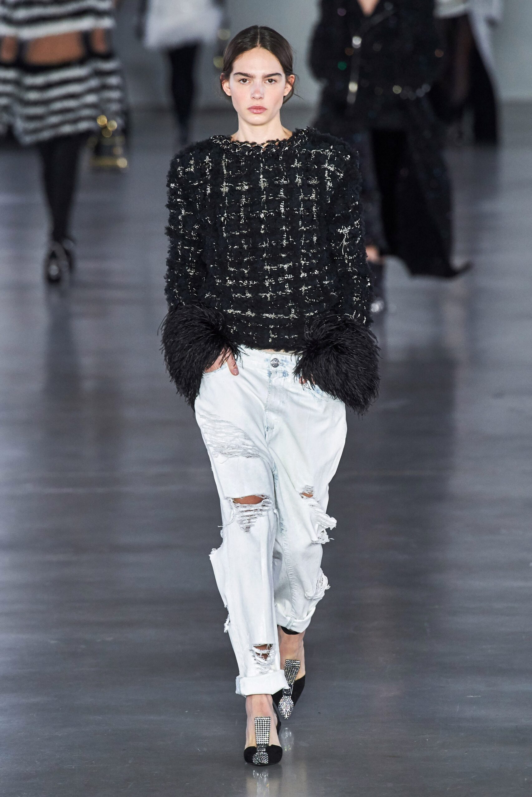 black fitted top with distressed jeans