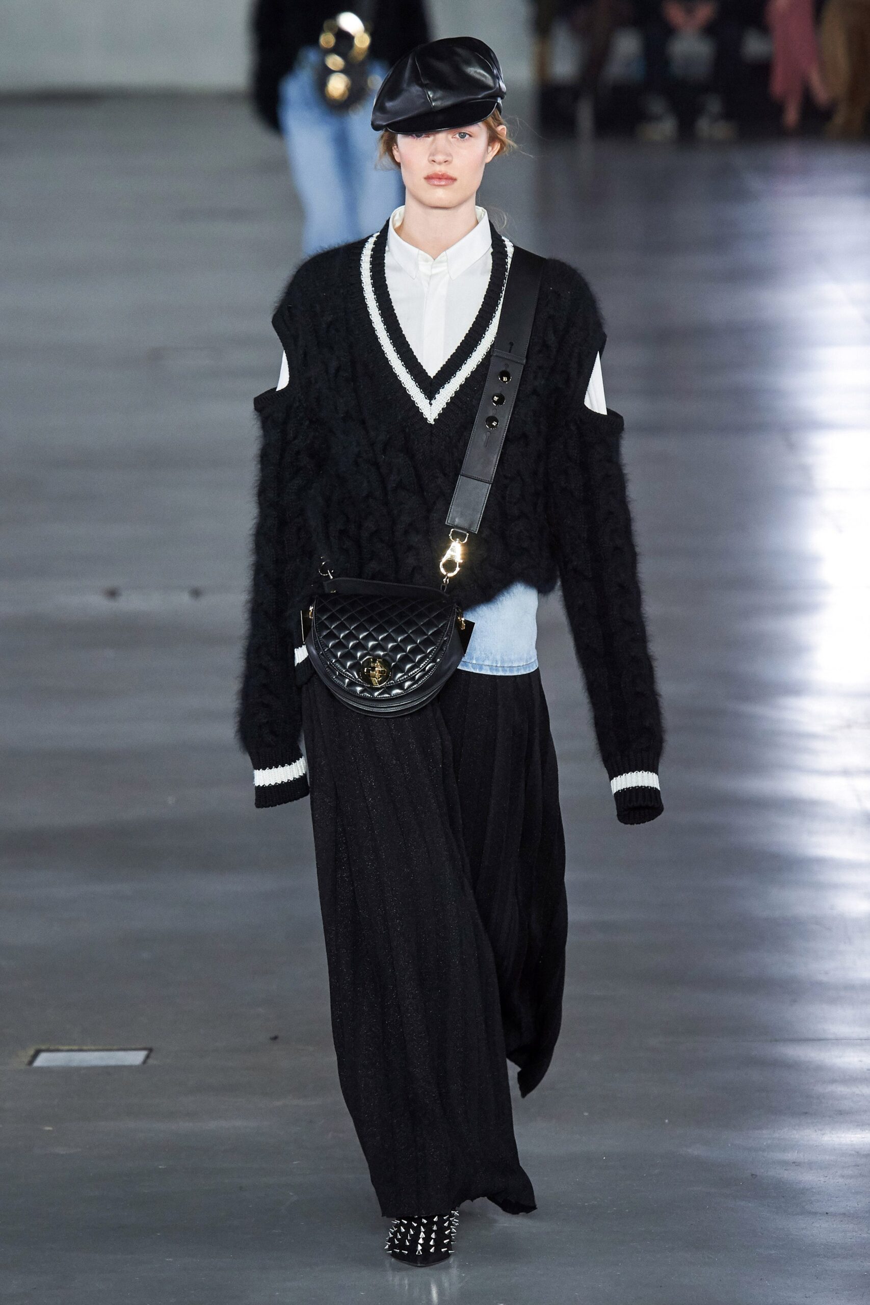 black relaxed sweater with white shirt