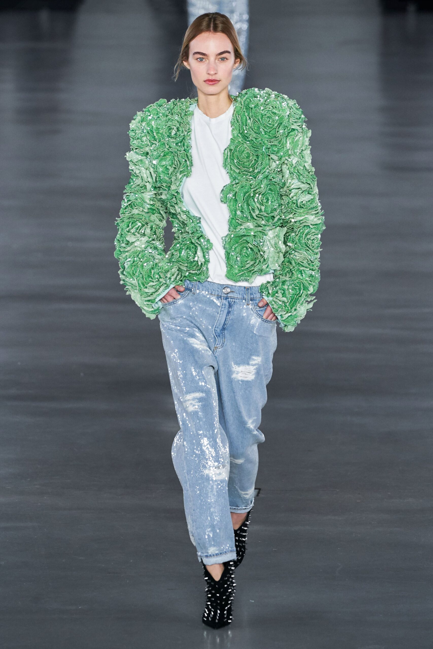 green ruffled jacket with jeans