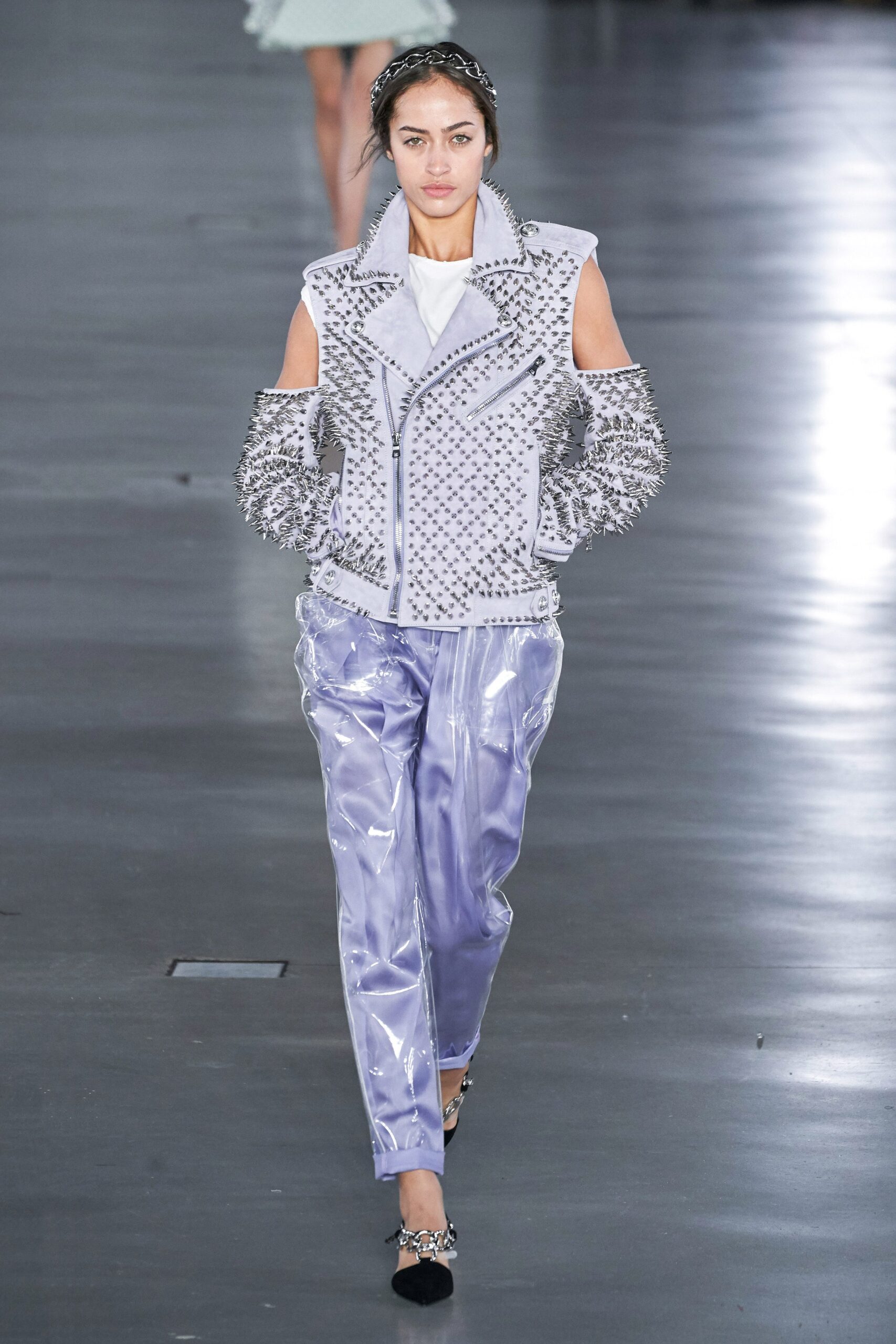 gray leather embellished jacket and purple vinyl pants