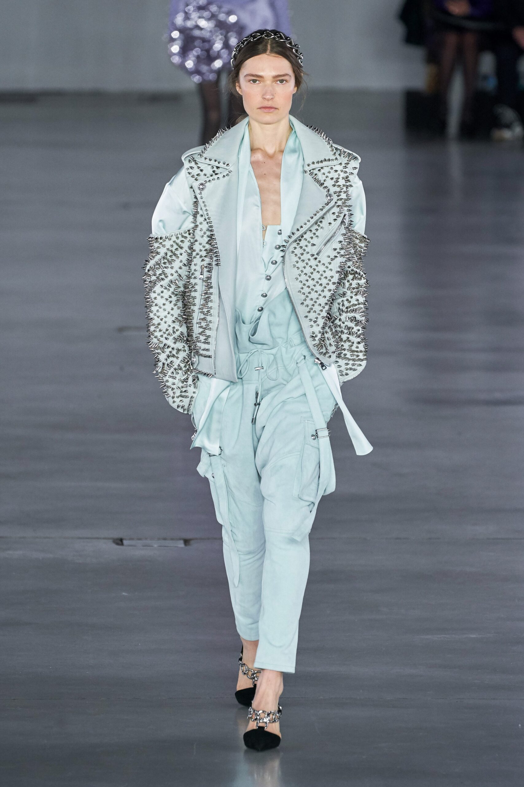 blue leather embellished jacket and cargo pants