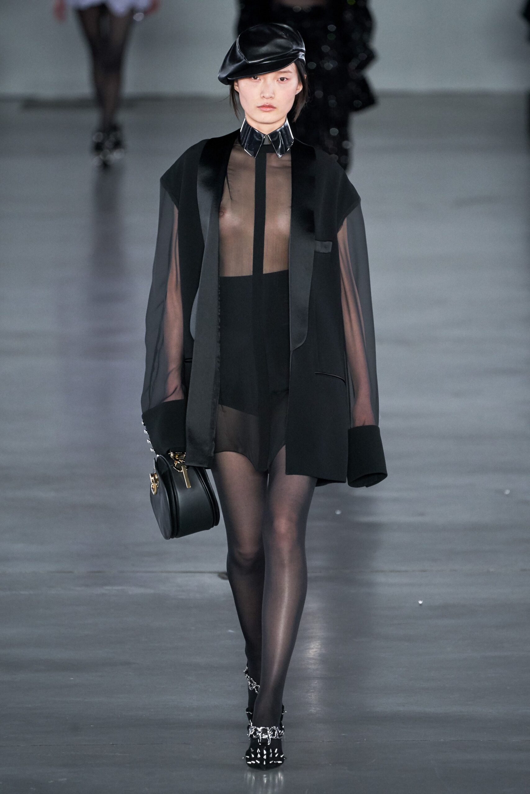 black sheer blouse and mini skirt