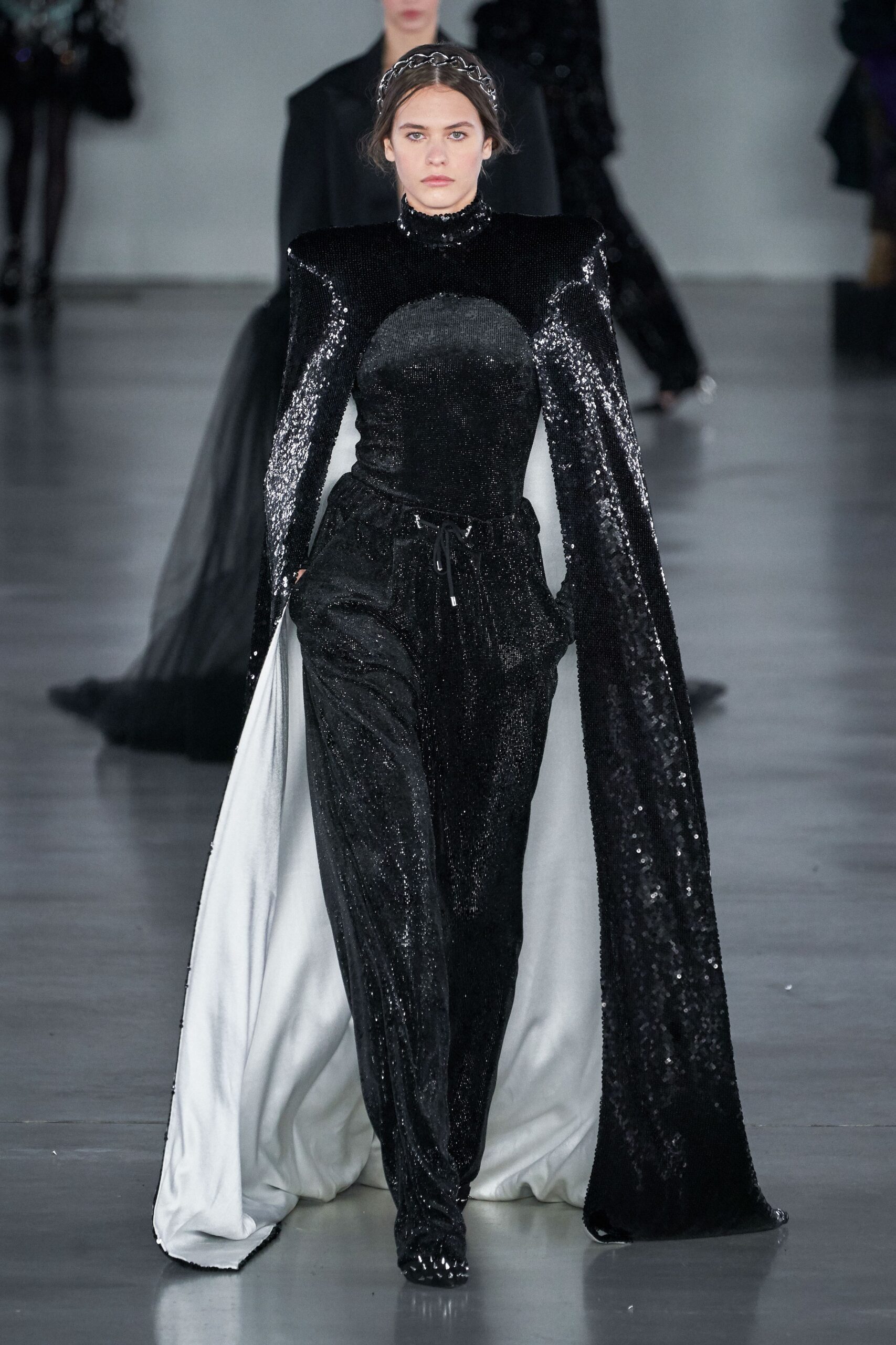 black velvet gown with white cape