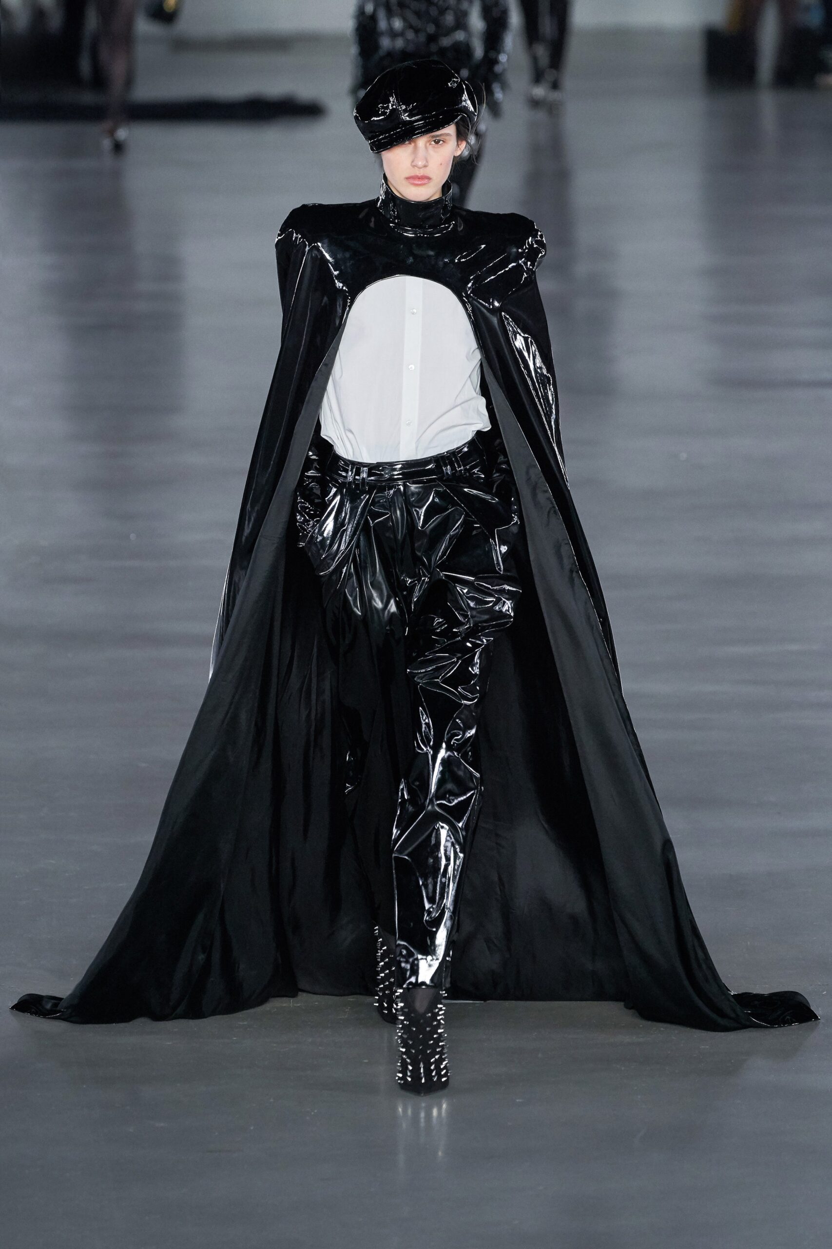 black vinyl cape with white shirt