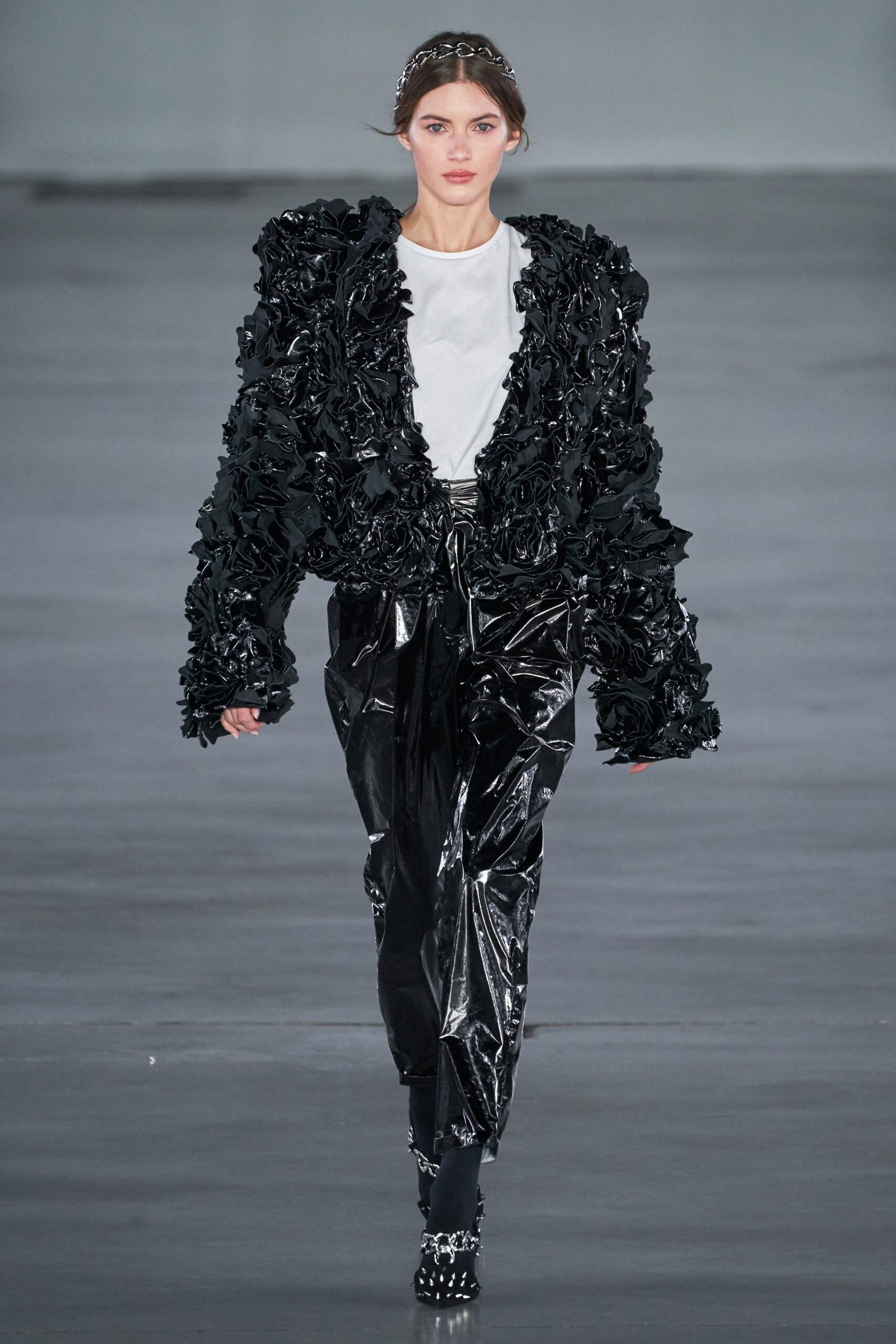 black vinyl ruffled jacket with white t-shirt