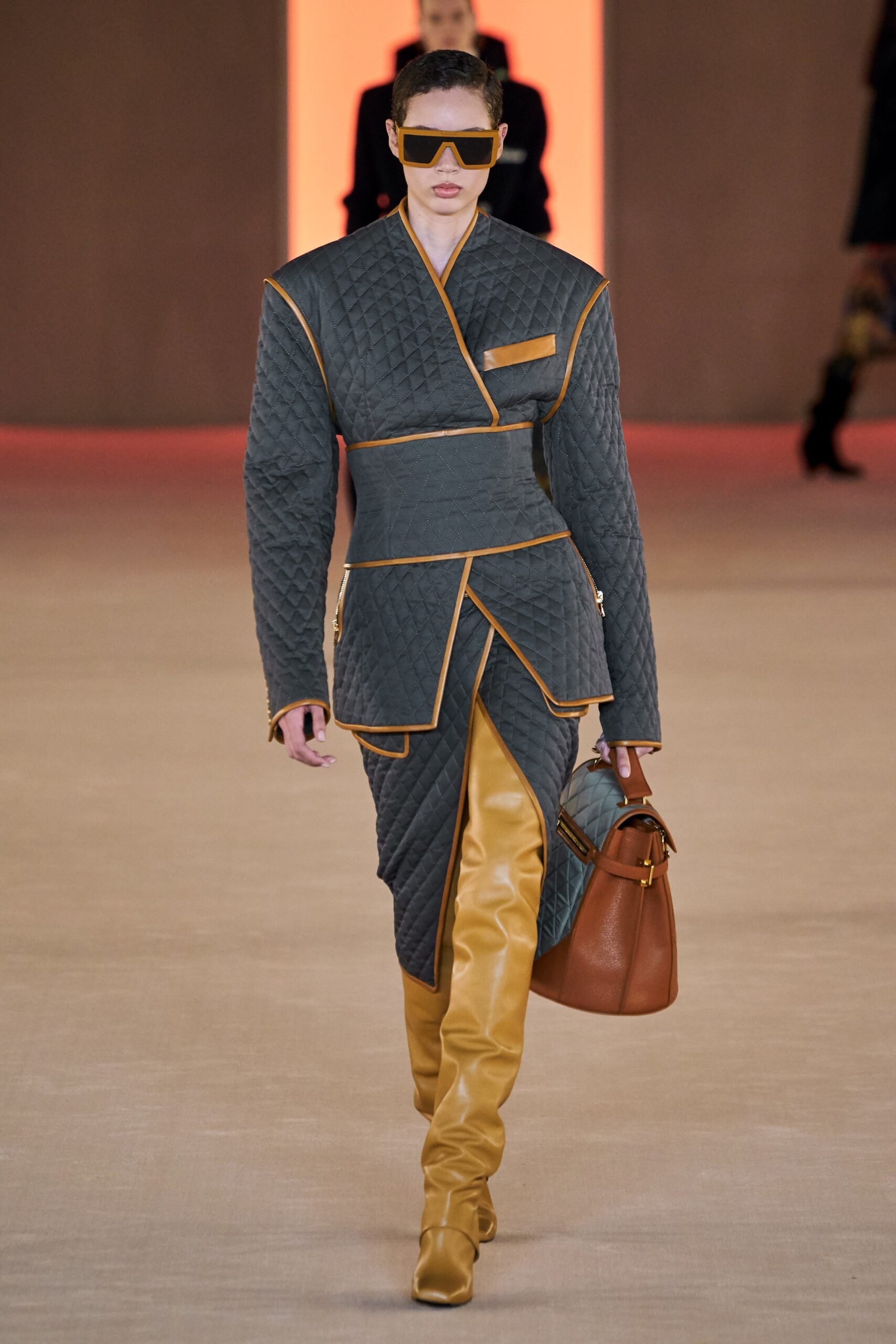 gray quilted coat with yellow pants
